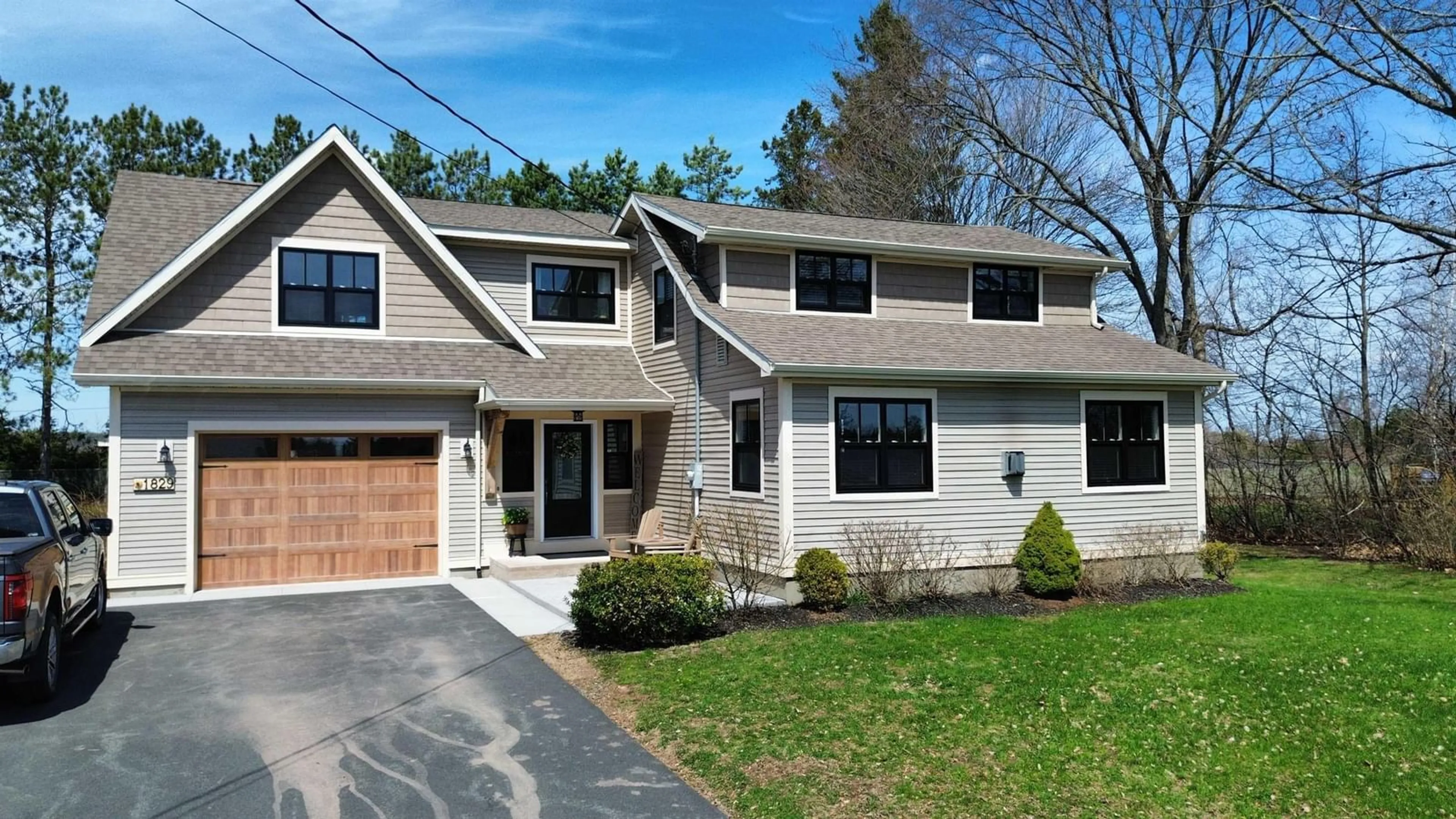 Home with vinyl exterior material, street for 1829 Black River Rd, Oxford Nova Scotia B0M 1P0
