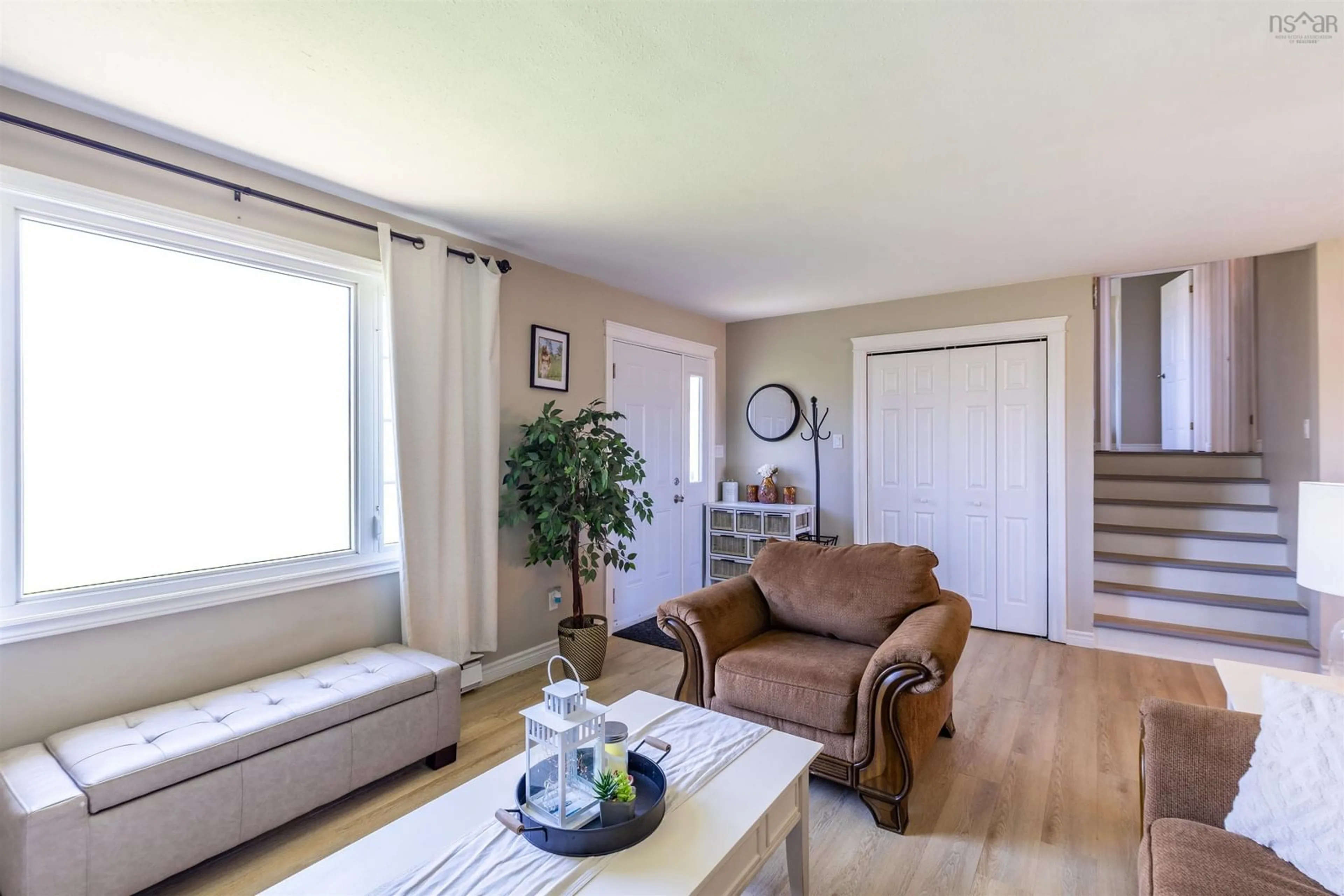 Living room with furniture, wood/laminate floor for 46 Heritage St, North Chegoggin Nova Scotia B5A 5K5
