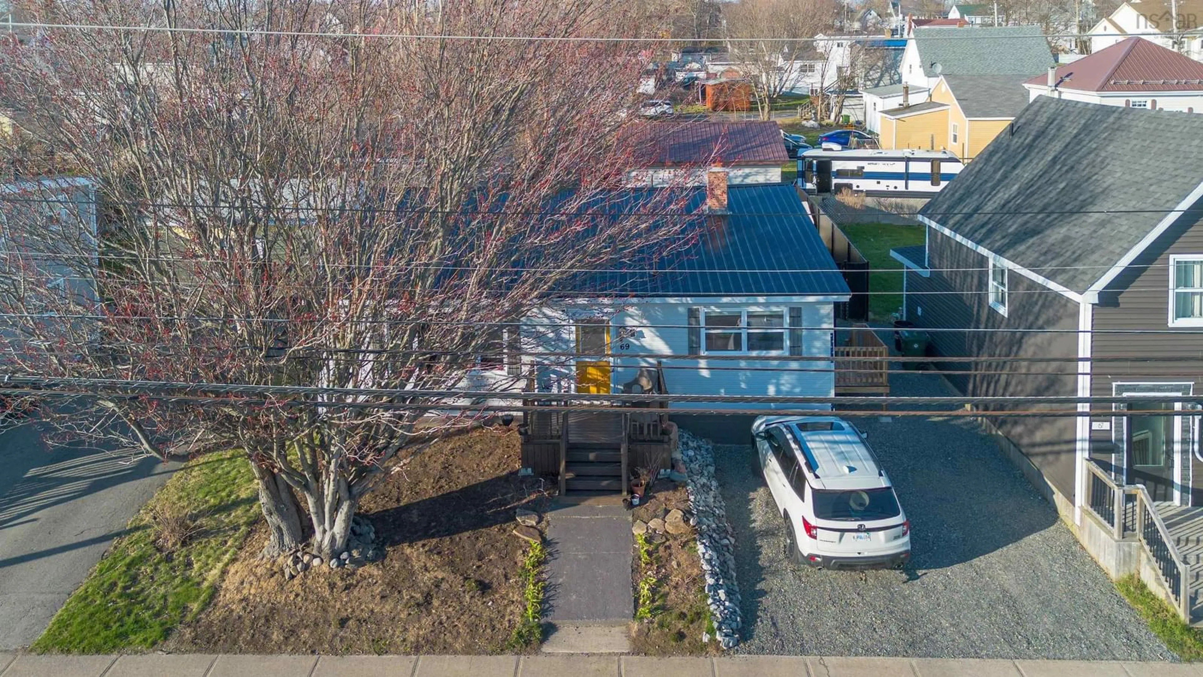 A pic from outside/outdoor area/front of a property/back of a property/a pic from drone, street for 69 Peppett St, North Sydney Nova Scotia B2A 2N7