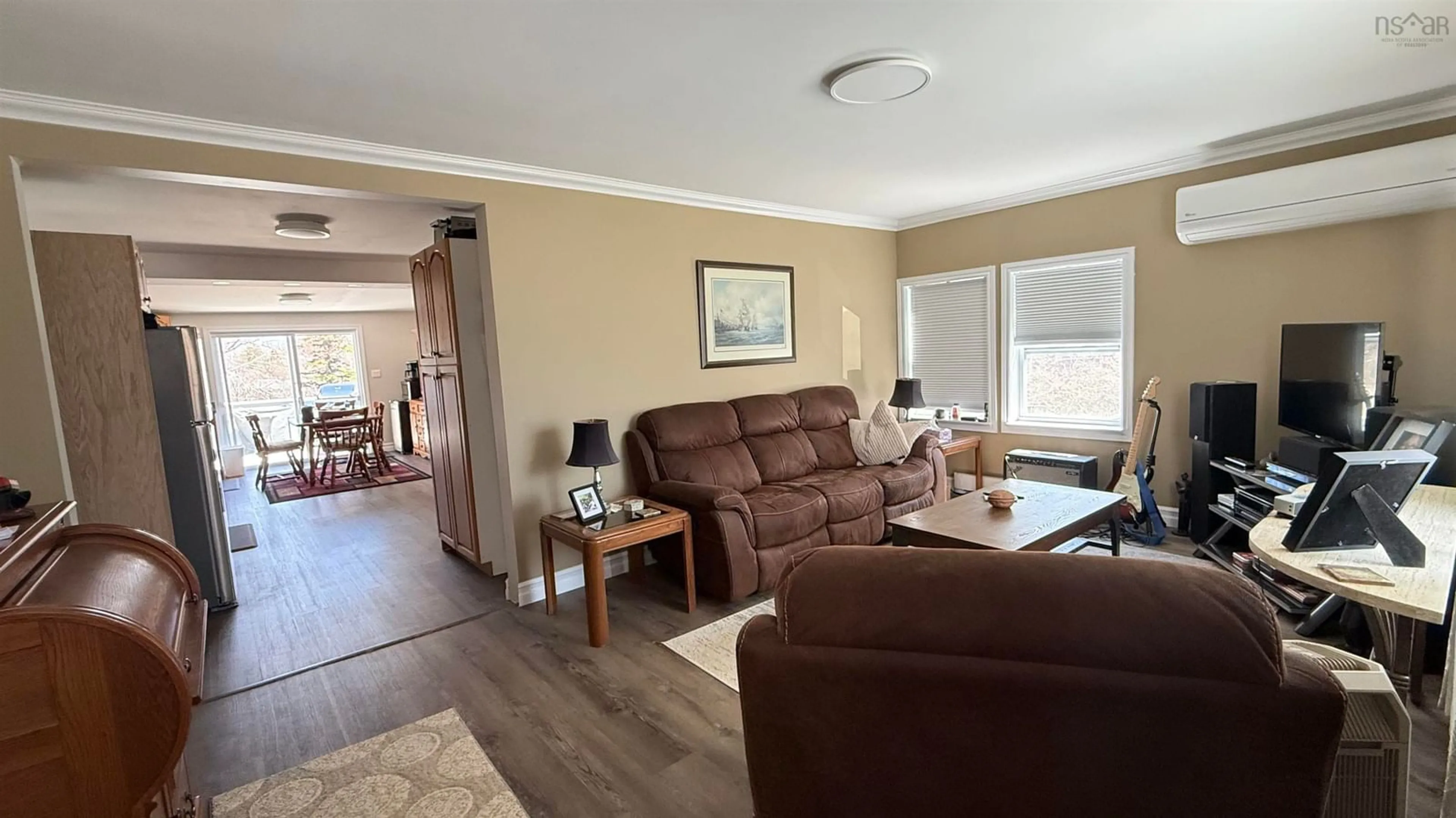 Living room with furniture, wood/laminate floor for 6491 Highway 3, Western Shore Nova Scotia B0J 3M0