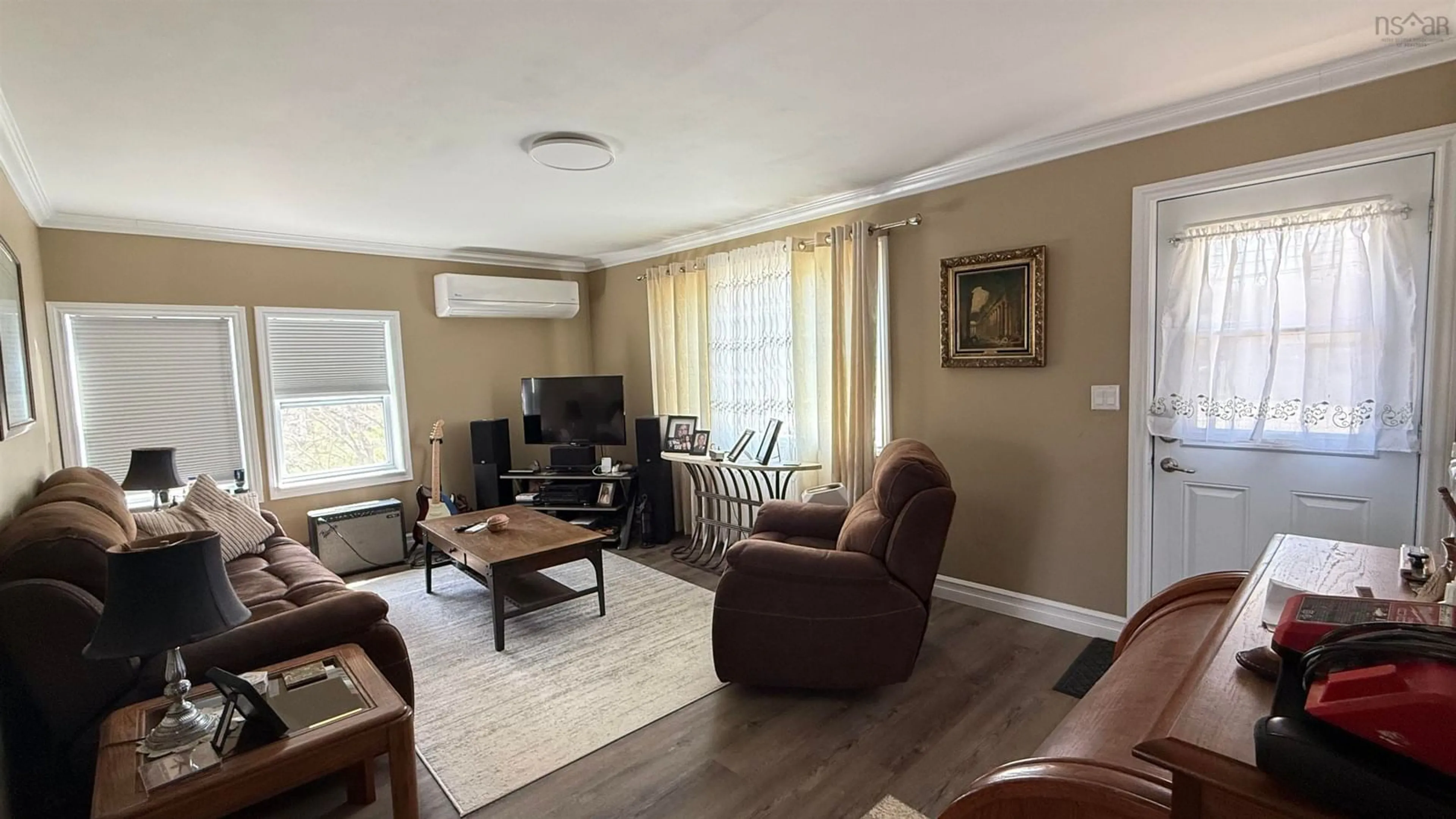 Living room with furniture, wood/laminate floor for 6491 Highway 3, Western Shore Nova Scotia B0J 3M0