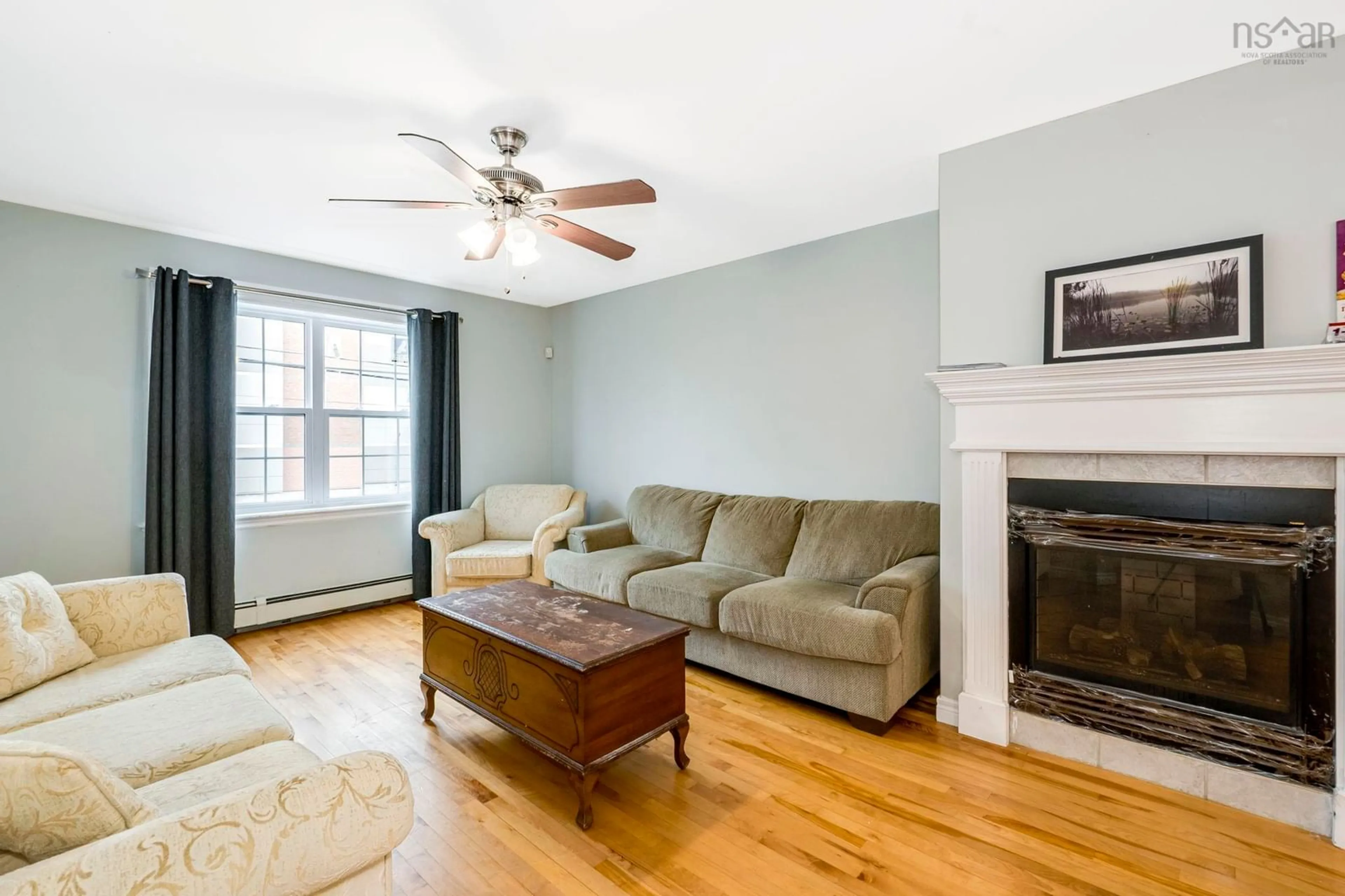 Living room with furniture, wood/laminate floor for 16 Prestwick Close, Clayton Park Nova Scotia B3S 1M4