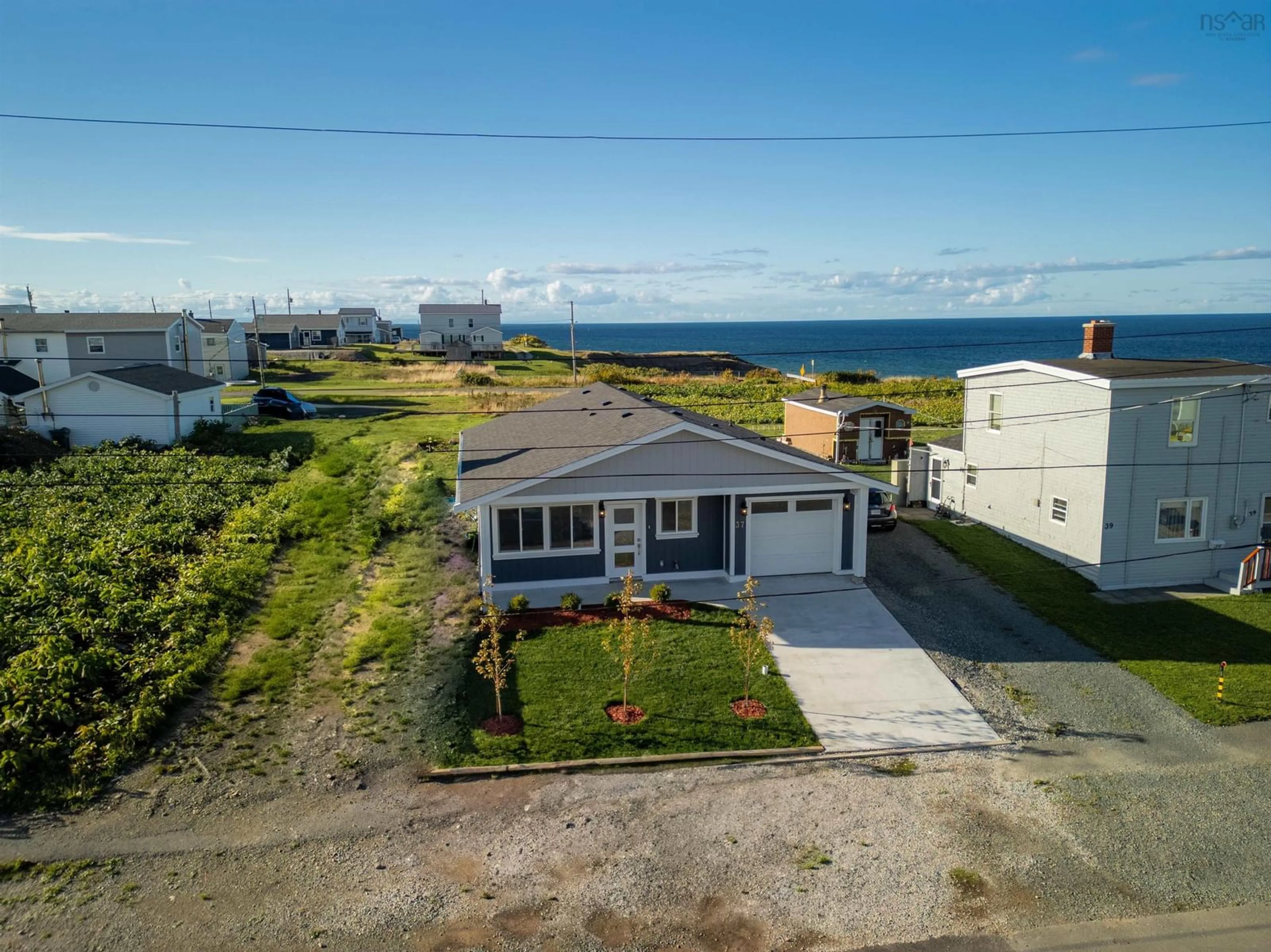 A pic from outside/outdoor area/front of a property/back of a property/a pic from drone, water/lake/river/ocean view for 37 Eighth Street St, Glace Bay Nova Scotia B1A 4K7