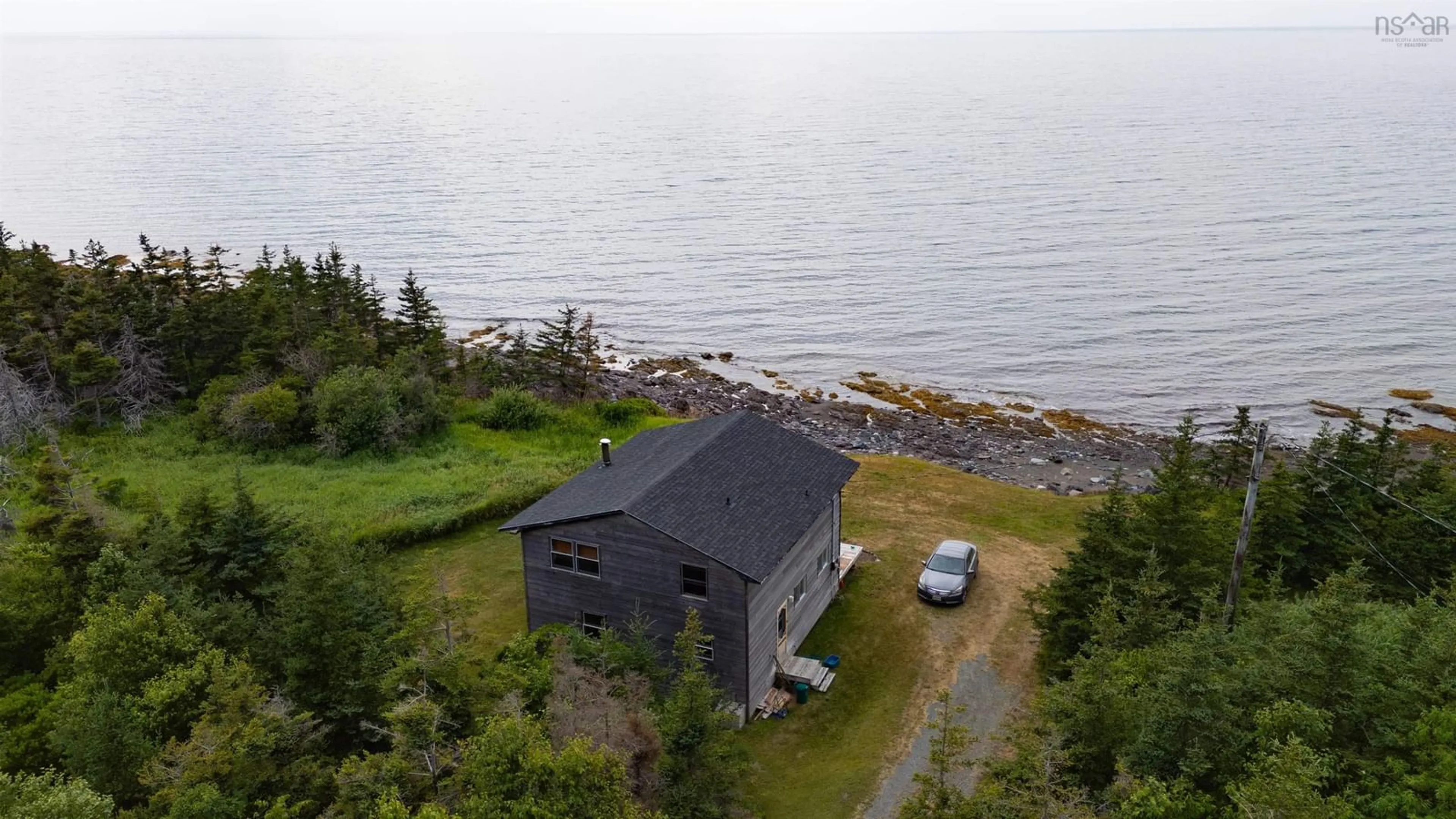 A pic from outside/outdoor area/front of a property/back of a property/a pic from drone, water/lake/river/ocean view for 83 Cottage Country Road, Livingstone Cove Nova Scotia B2G 2L1