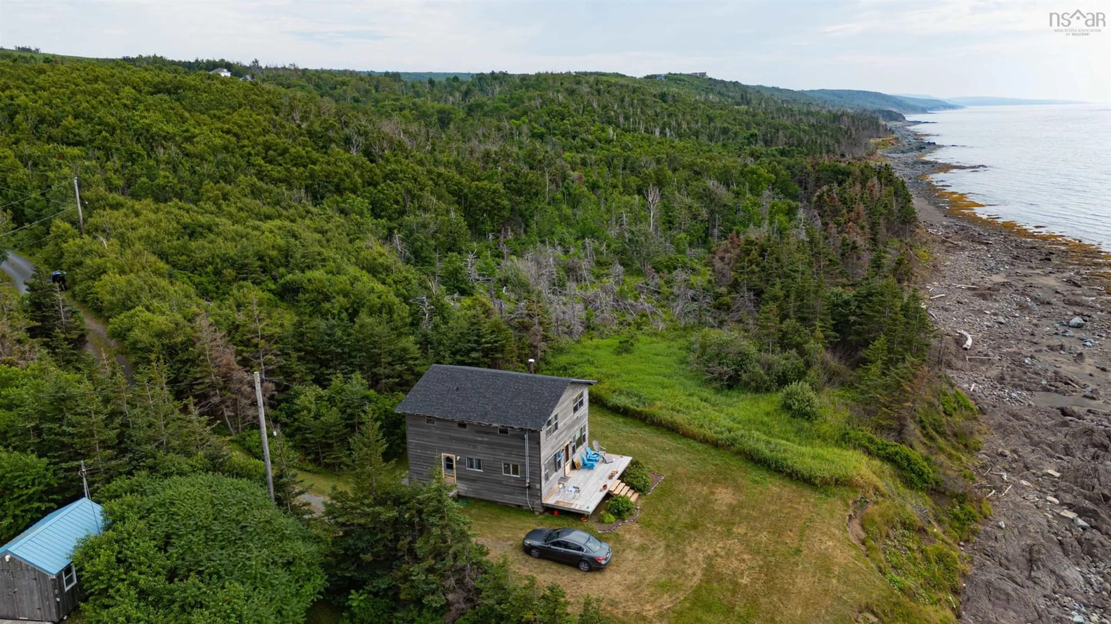 A pic from outside/outdoor area/front of a property/back of a property/a pic from drone, water/lake/river/ocean view for 83 Cottage Country Road, Livingstone Cove Nova Scotia B2G 2L1