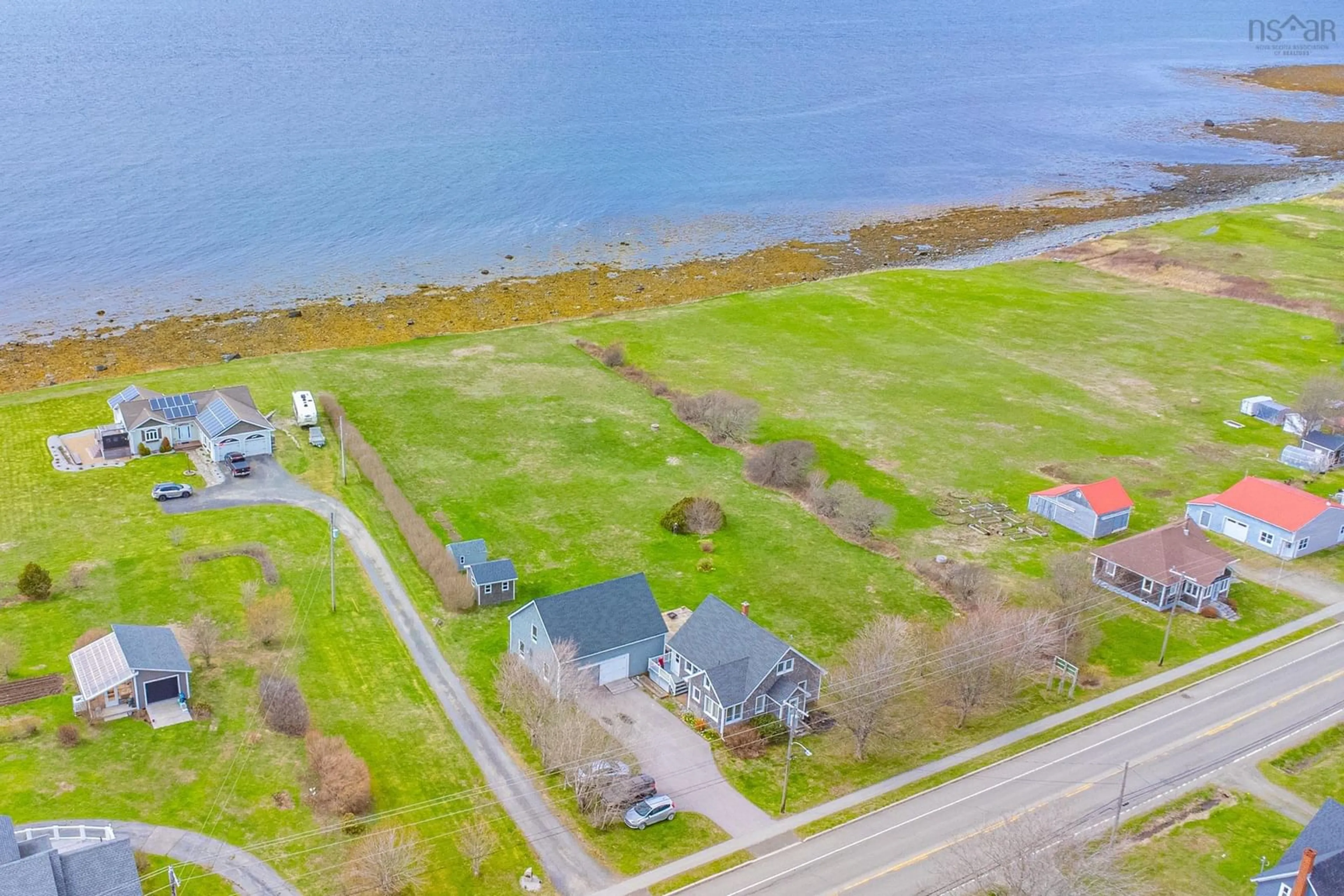 A pic from outside/outdoor area/front of a property/back of a property/a pic from drone, water/lake/river/ocean view for 923 Highway 1, Little Brook Nova Scotia B0W 1M0
