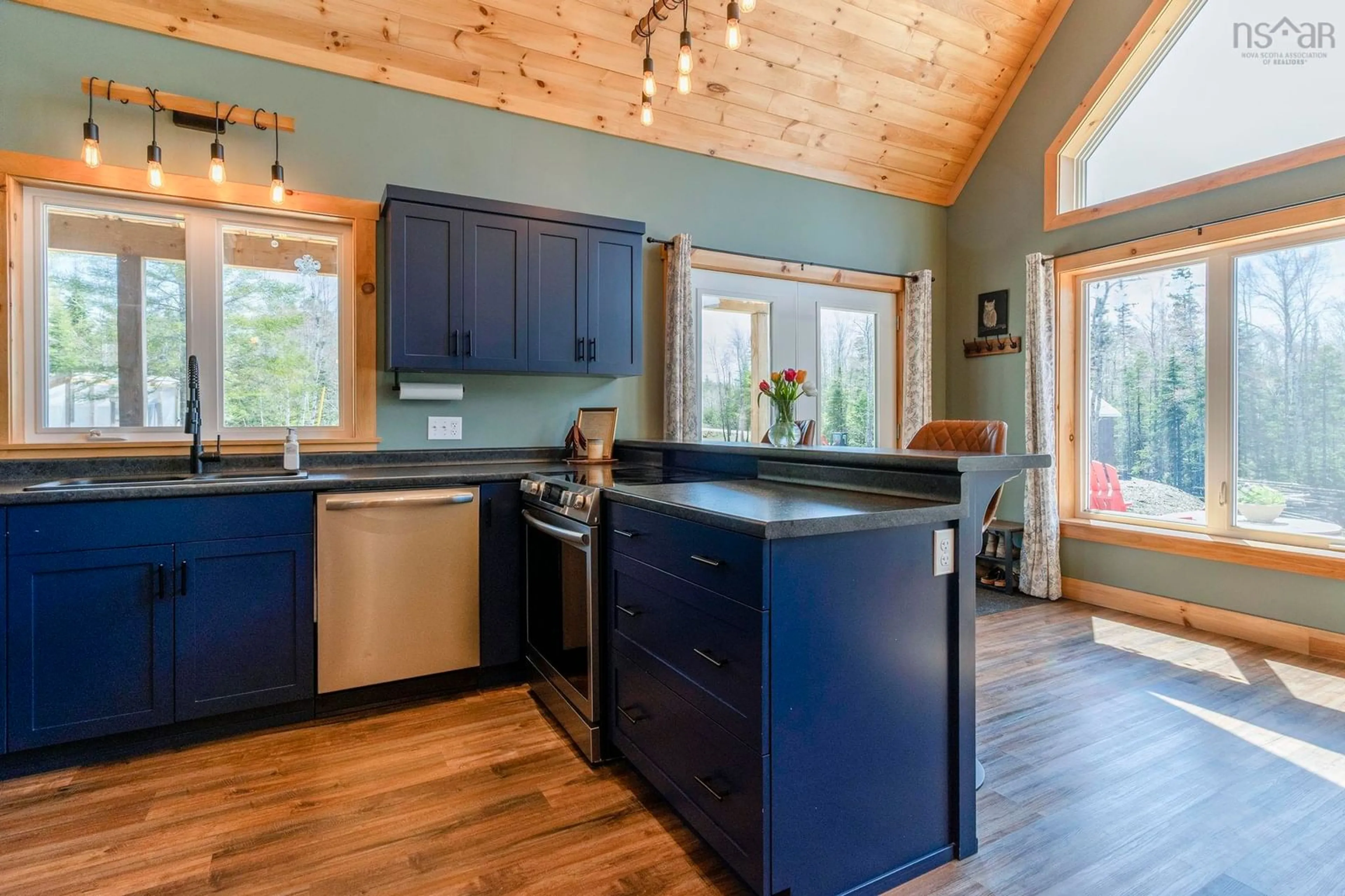 Open concept kitchen, wood/laminate floor for 294 Alpena Rd, Nictaux South Nova Scotia B0S 1P0