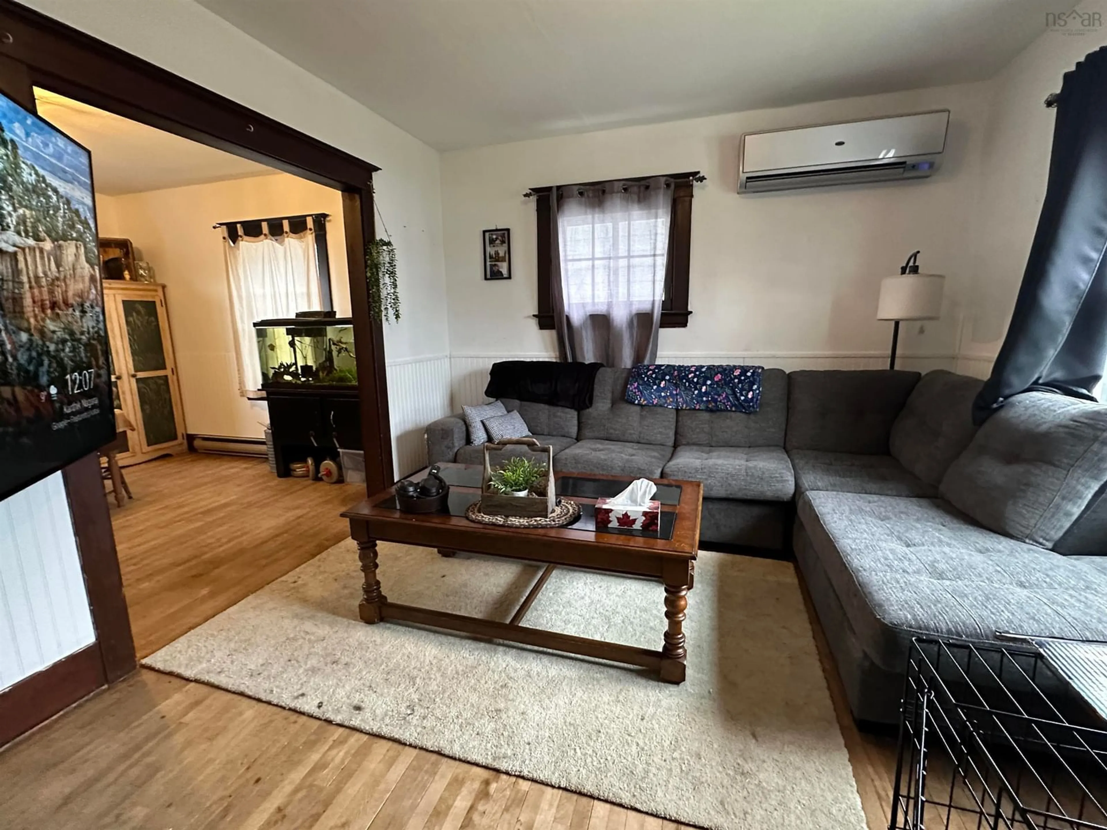 Living room with furniture, wood/laminate floor for 19 Markland Ave, Brooklyn Nova Scotia B0J 1H0