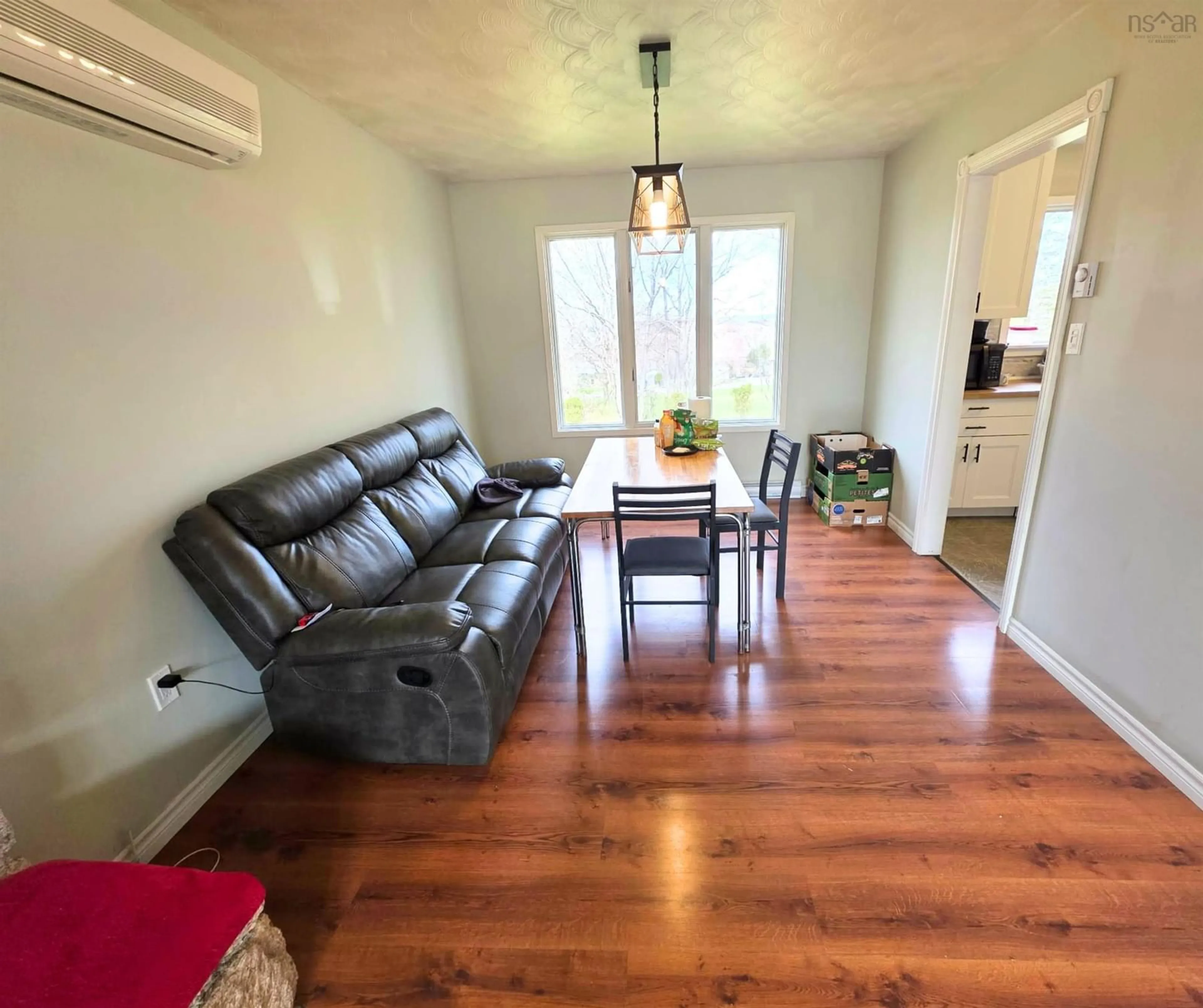 Living room with furniture, wood/laminate floor for 70 Glenn Ave, Sydney River Nova Scotia B1S 3B2