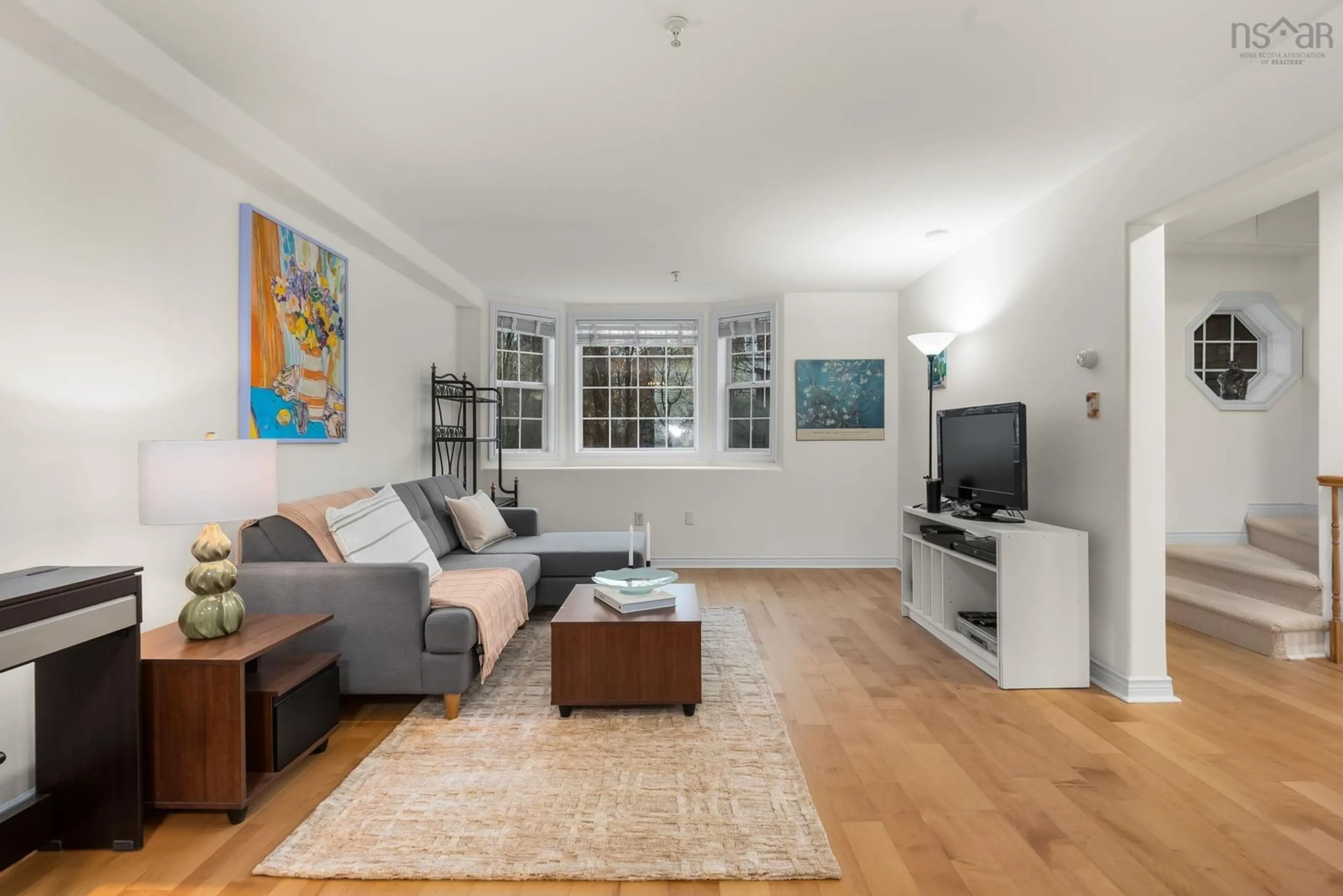 Living room with furniture, wood/laminate floor for Harvey Street, Halifax, Ns B3j1a7 St #5224B, Halifax Nova Scotia B3J 1A7