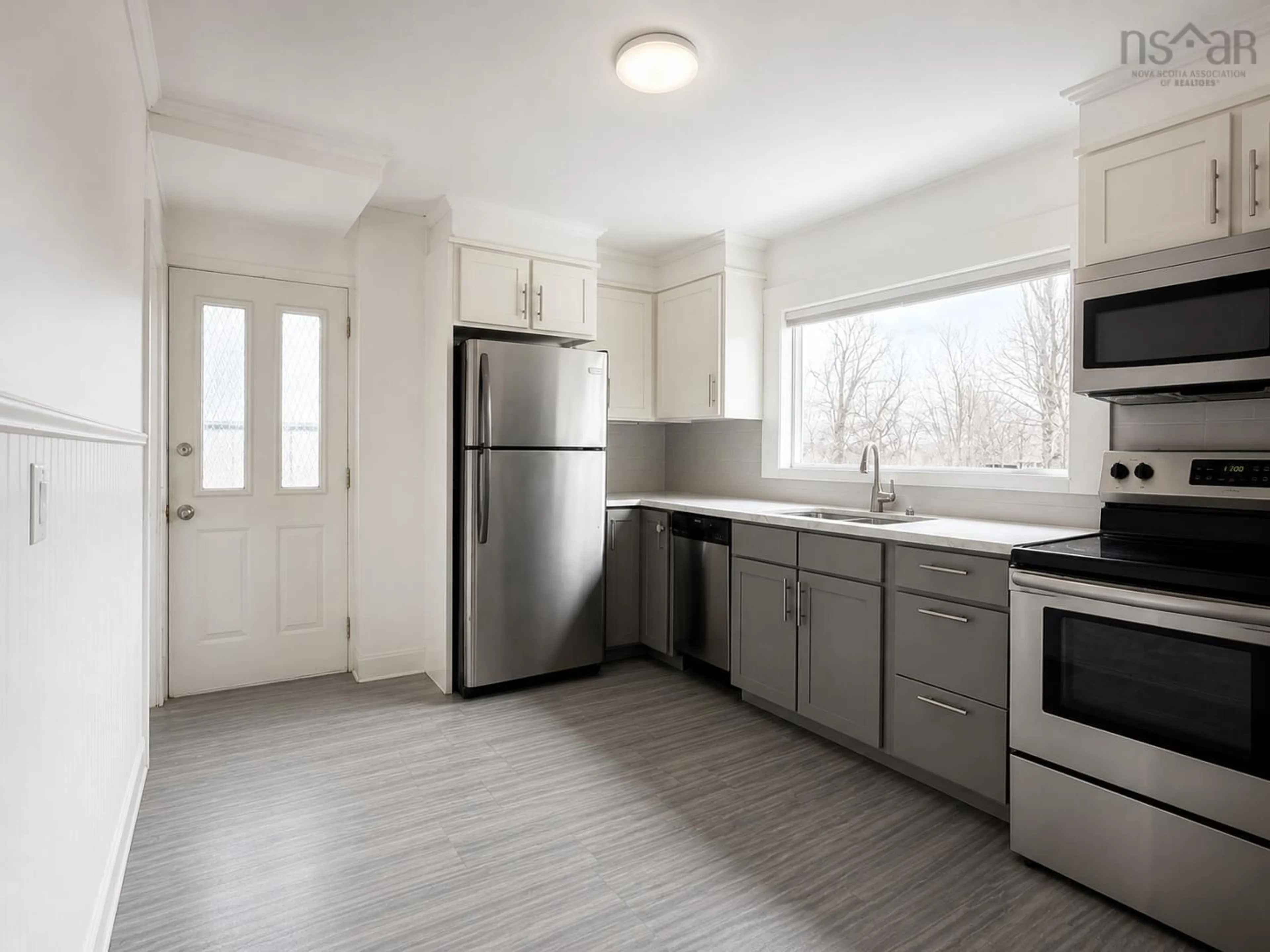 Open concept kitchen, wood/laminate floor for 30 Munroe Ave, New Glasgow Nova Scotia B2H 2E5