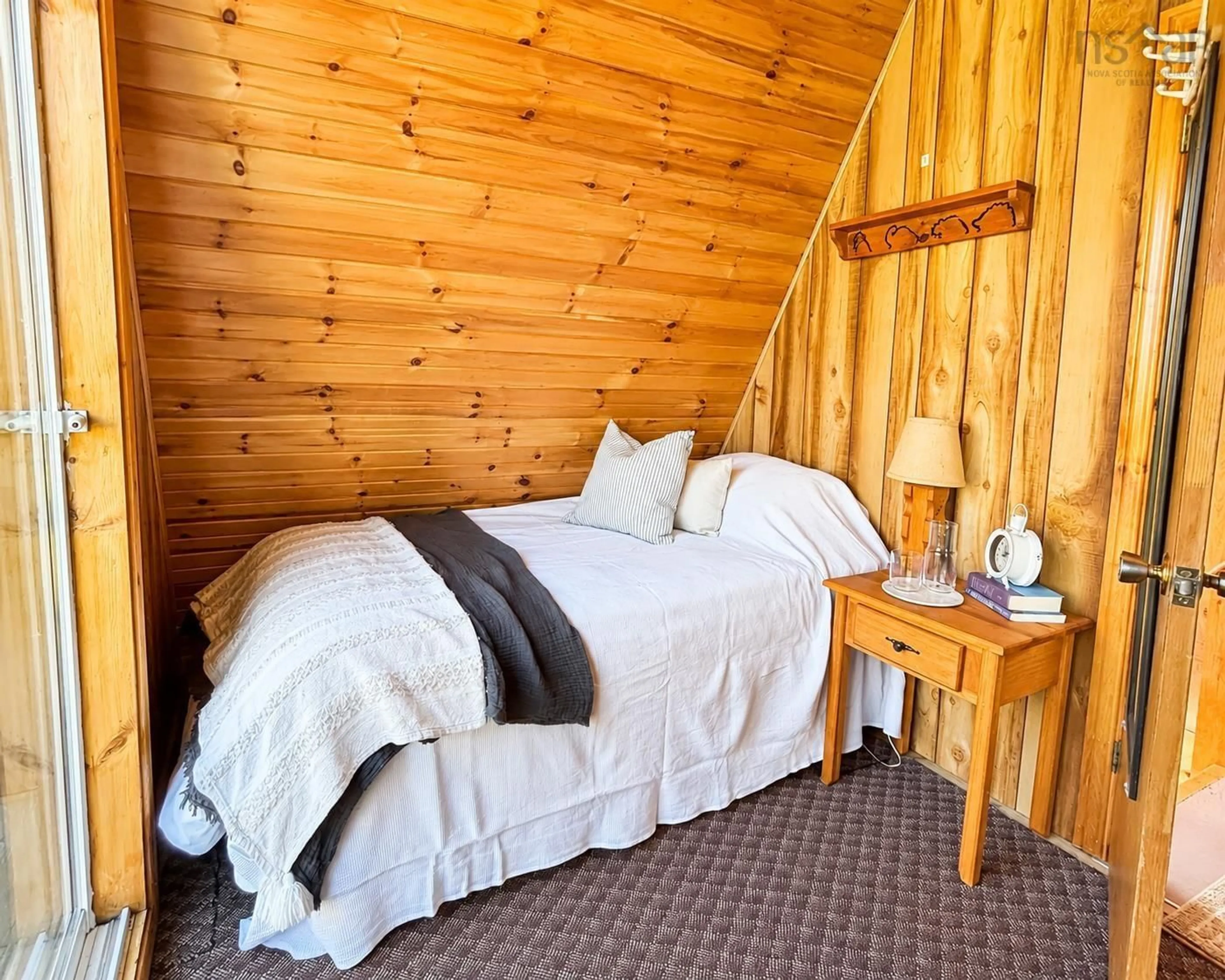 Bedroom with bed, wood/laminate floor for 139 Murray Lane, Chance Harbour Nova Scotia B0K 1X0
