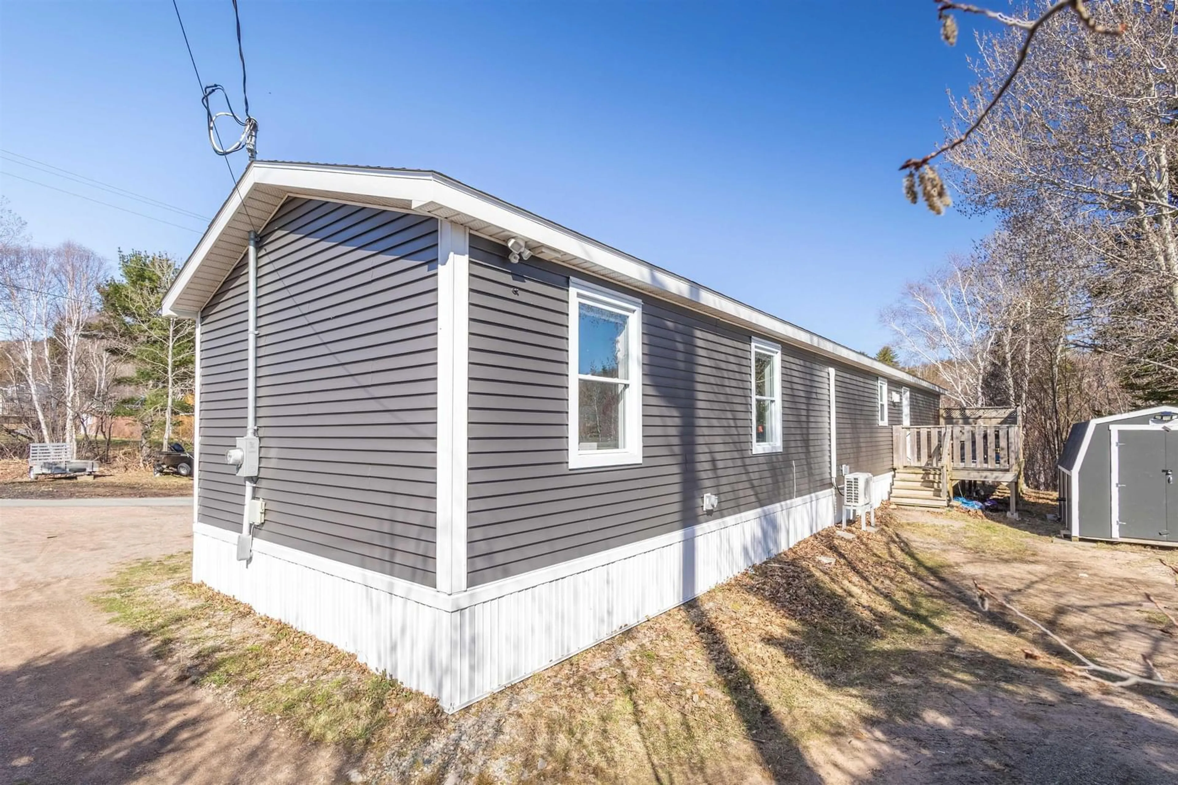 Home with vinyl exterior material, street for 4 Kelly's Lane, Ingonish Beach Nova Scotia B0C 1L0