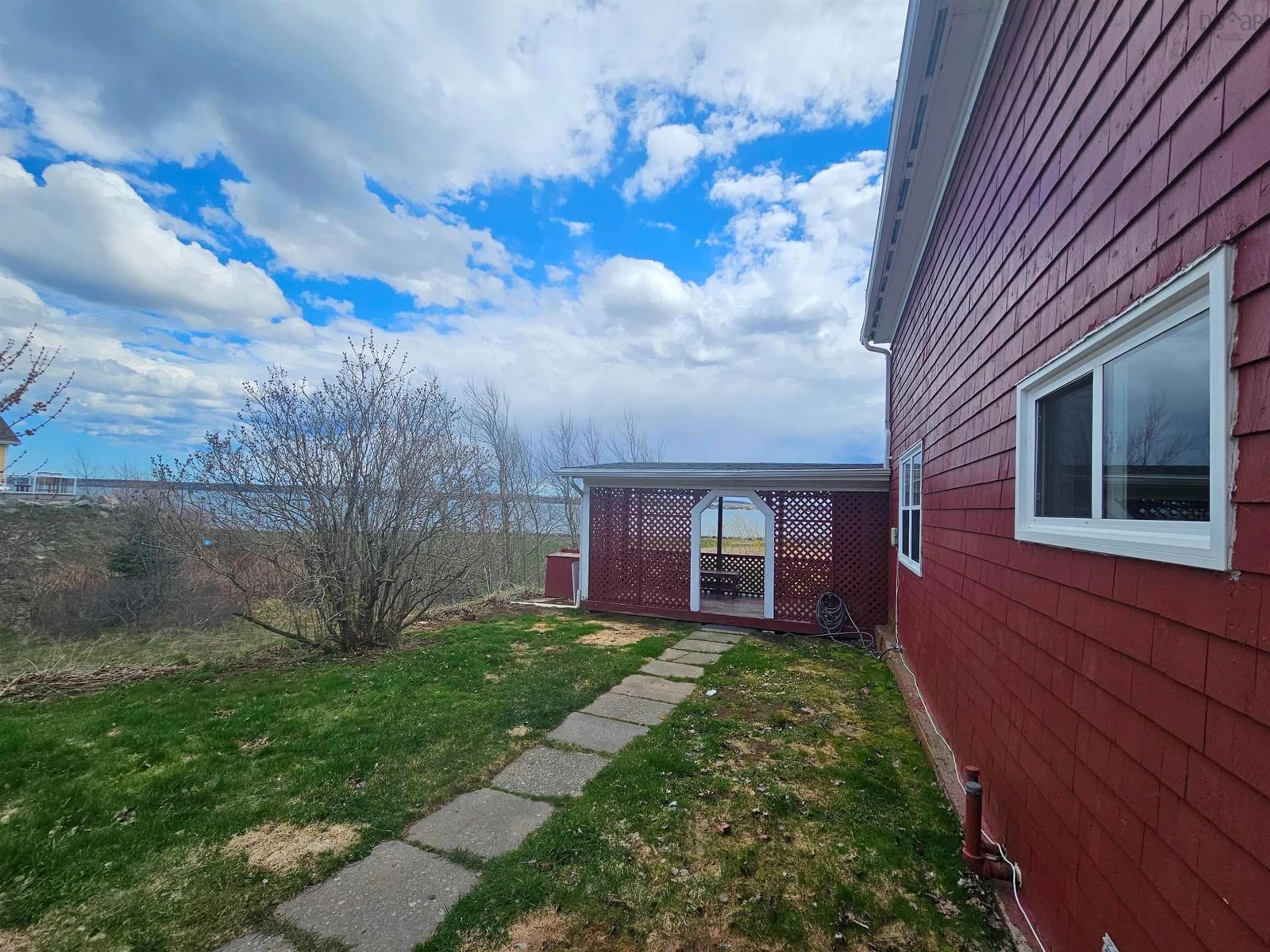 A pic from outside/outdoor area/front of a property/back of a property/a pic from drone, water/lake/river/ocean view for 455 Purves St, North Sydney Nova Scotia B2A 1C7
