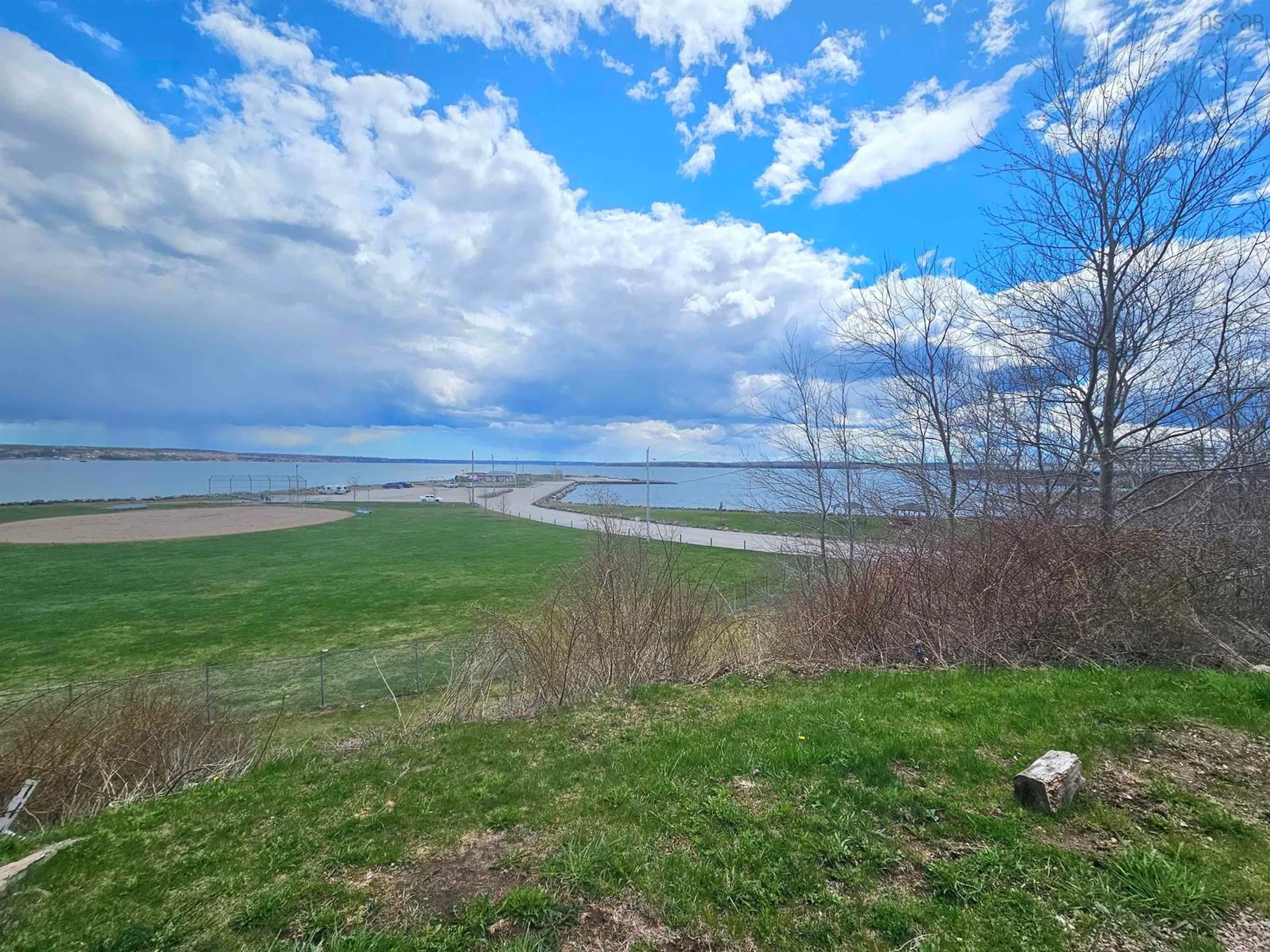 A pic from outside/outdoor area/front of a property/back of a property/a pic from drone, water/lake/river/ocean view for 455 Purves St, North Sydney Nova Scotia B2A 1C7