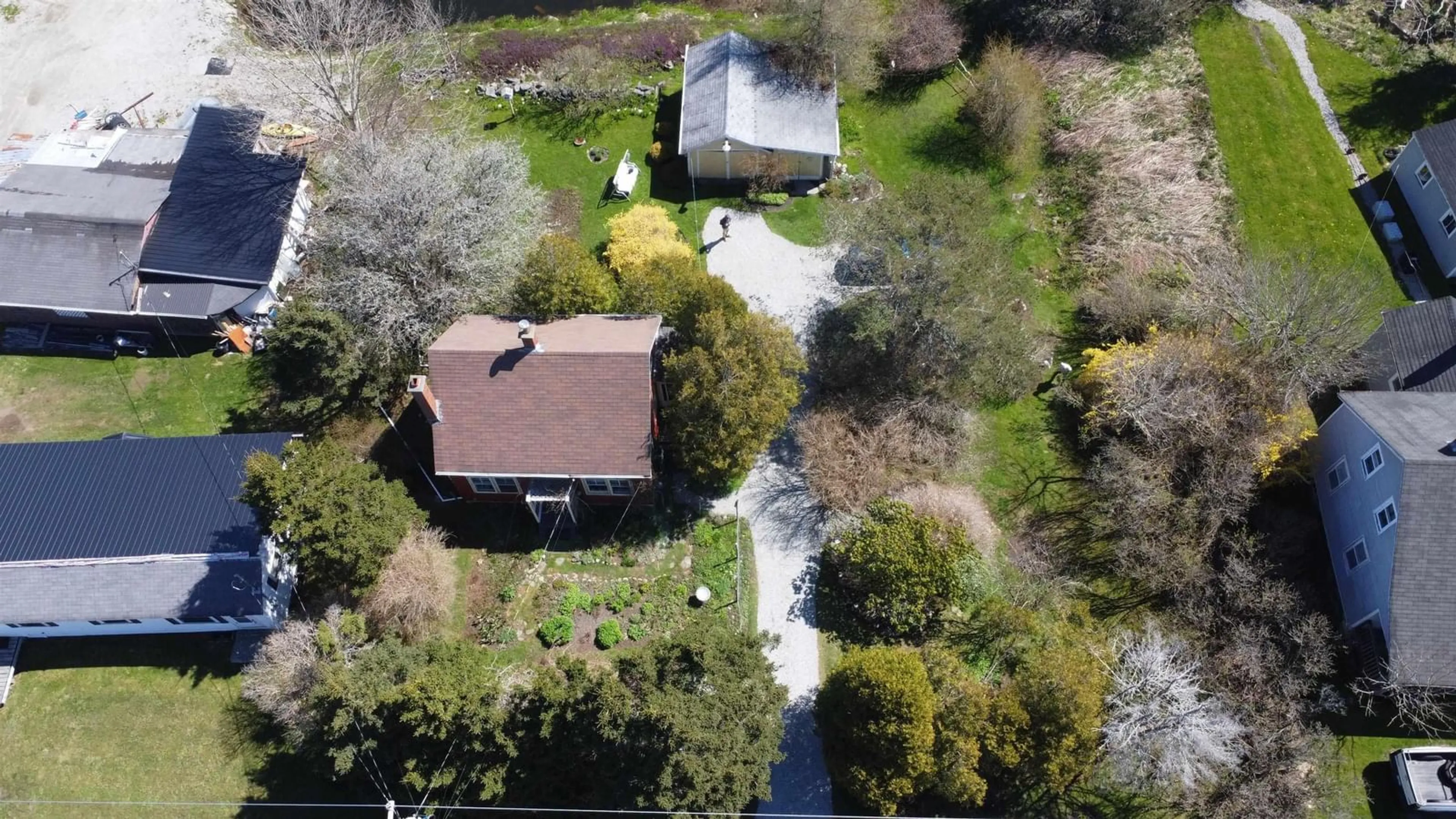 A pic from outside/outdoor area/front of a property/back of a property/a pic from drone, street for 42 Main Shore Rd, Milton Highlands Nova Scotia B5A 4K2