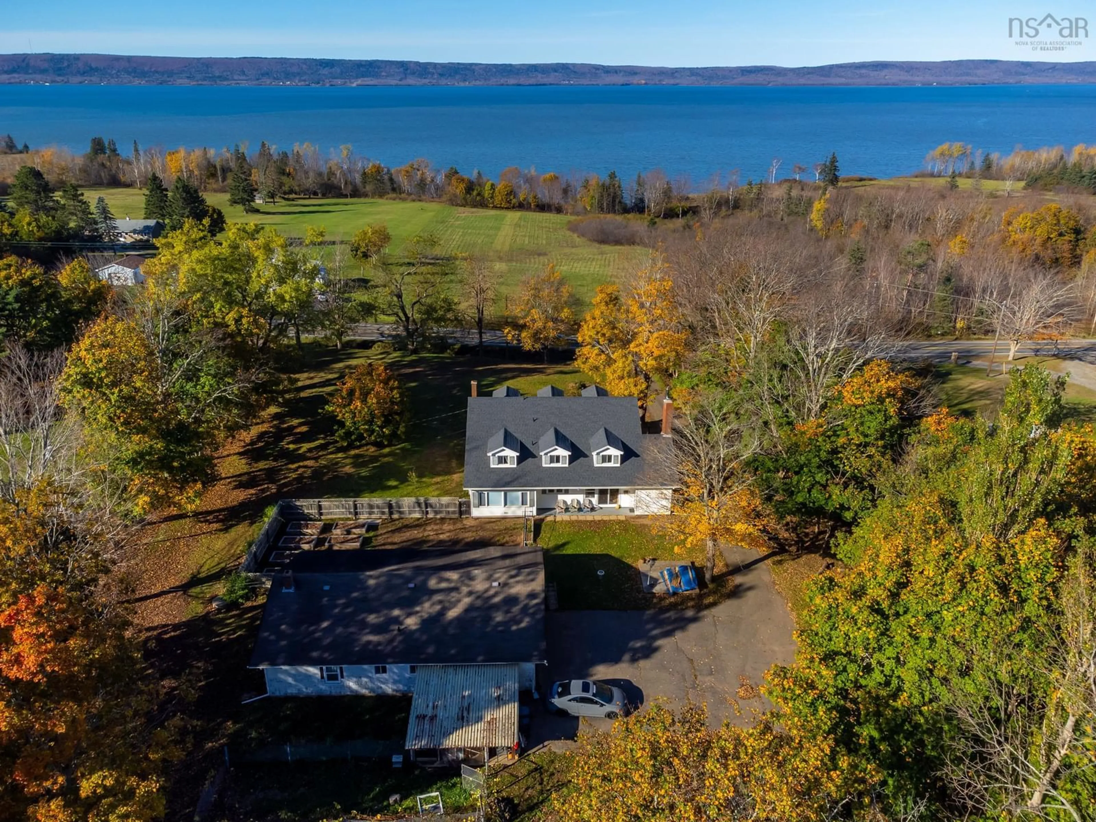 A pic from outside/outdoor area/front of a property/back of a property/a pic from drone, water/lake/river/ocean view for 428 Highway 1, Deep Brook Nova Scotia B0S 1J0