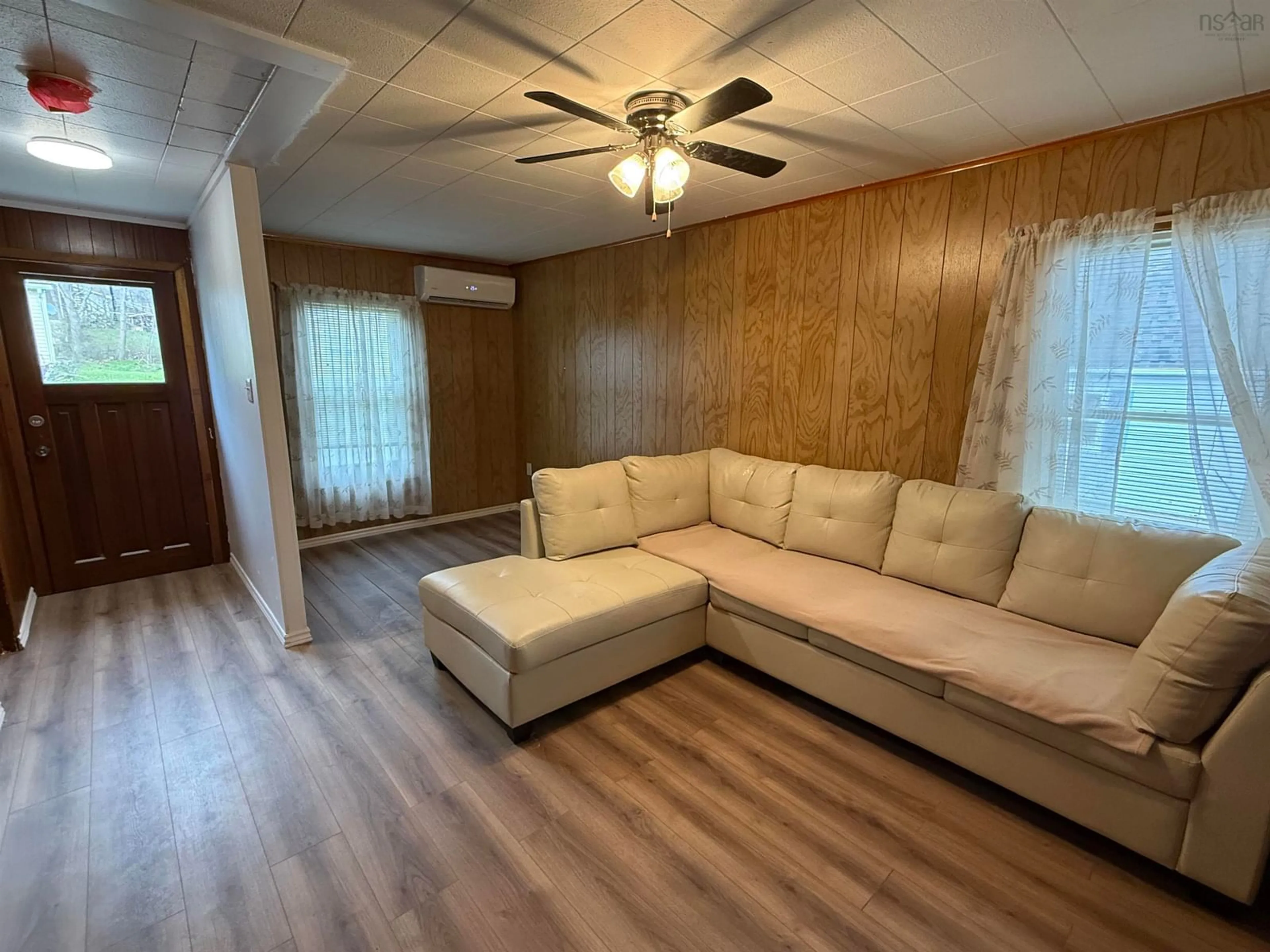 Living room with furniture, wood/laminate floor for 45 Martha St, Pictou Nova Scotia B0K 1H0