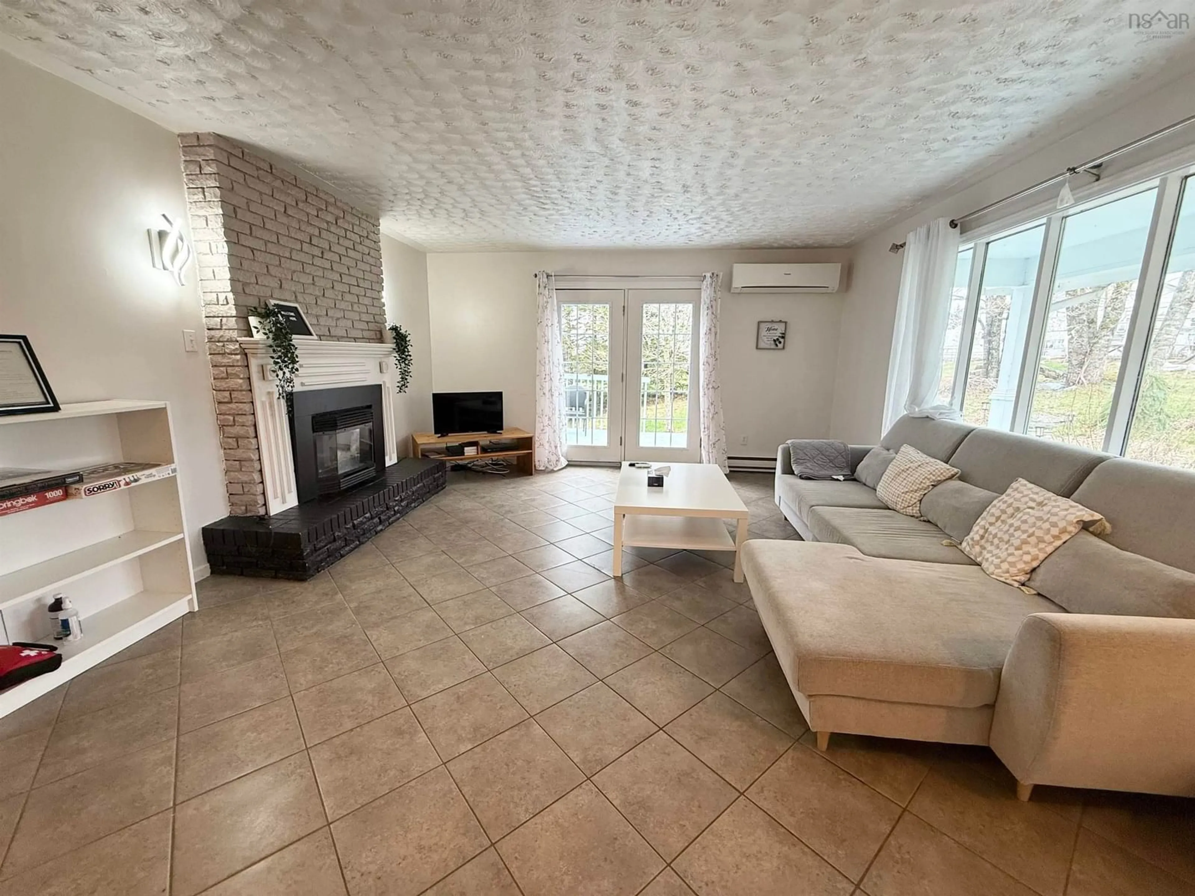Living room with furniture, ceramic/tile floor for 82 & 86 Pulsifer Rd, Wittenburg Nova Scotia B0N 2J0