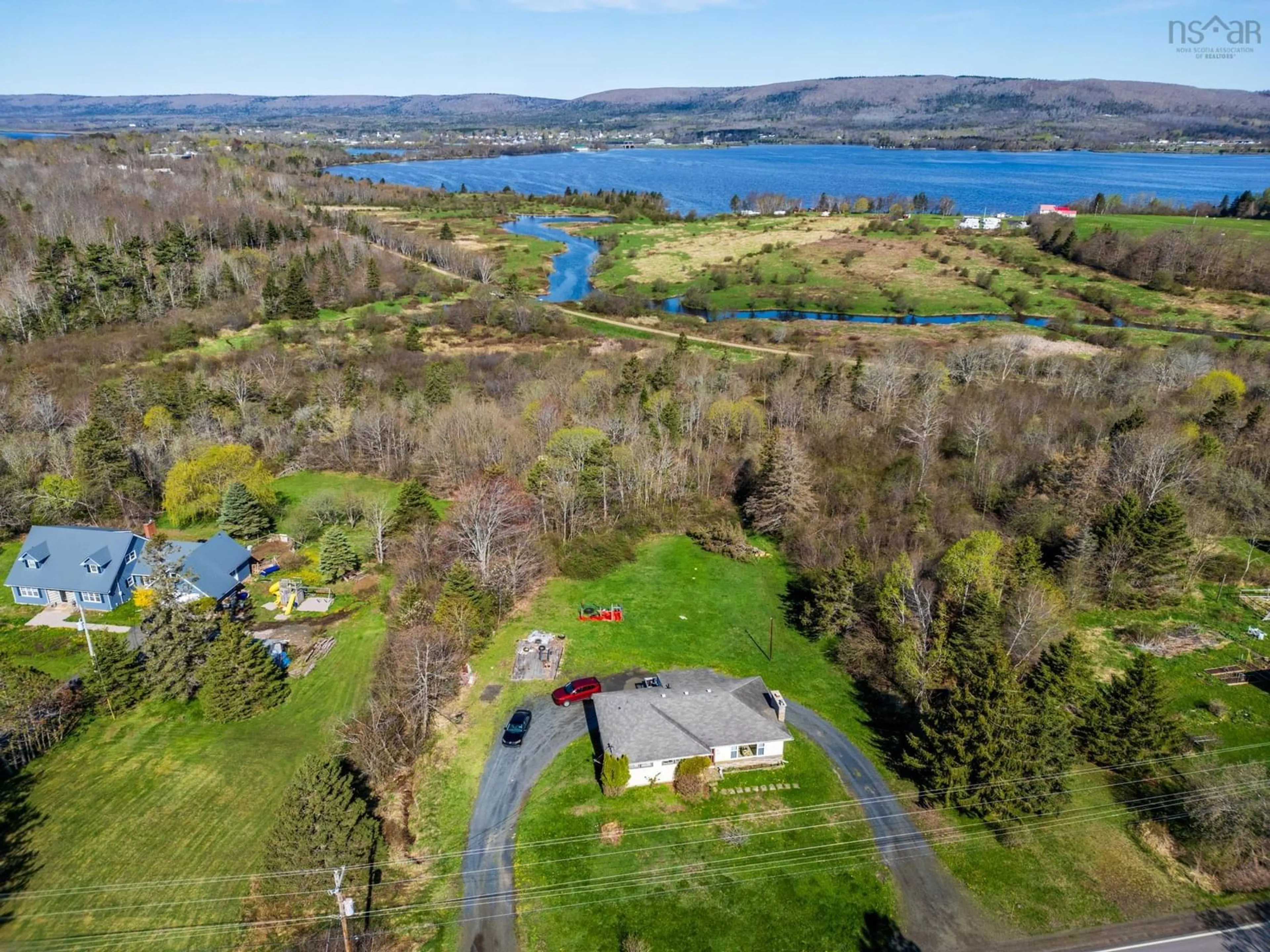 A pic from outside/outdoor area/front of a property/back of a property/a pic from drone, water/lake/river/ocean view for 301 Highway 201, Moschelle Nova Scotia B0S 1A0