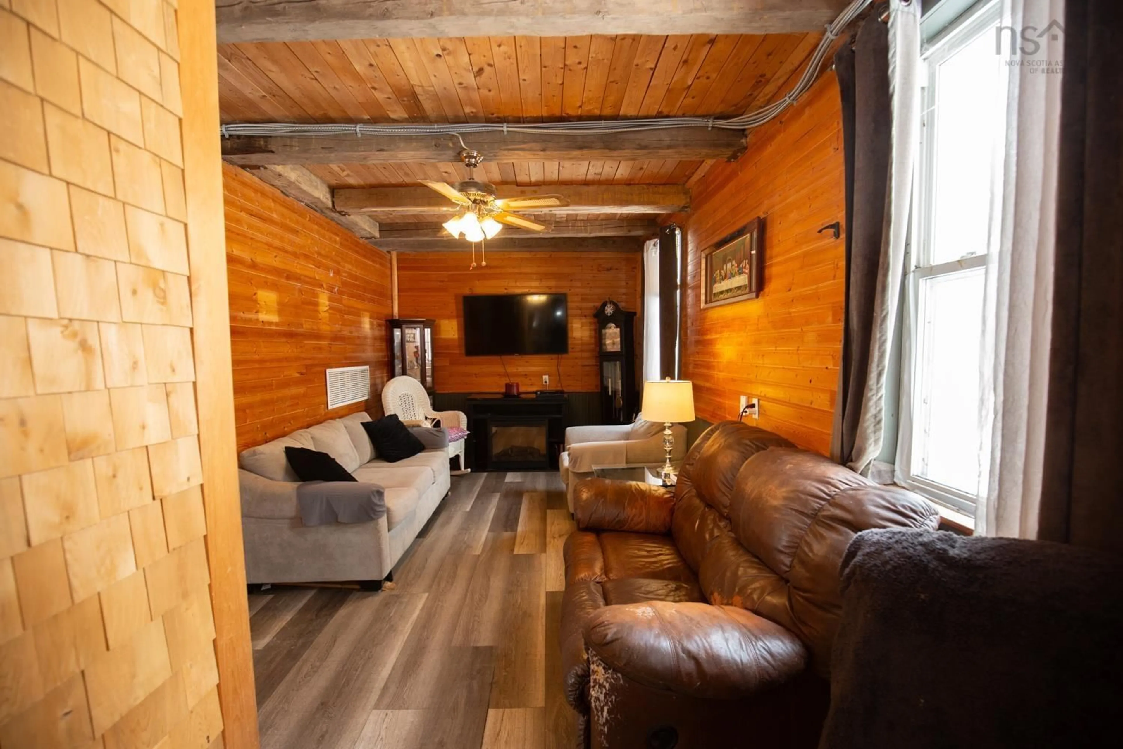 Living room with furniture, wood/laminate floor for 107 Upper Pembroke Rd, Pembroke Nova Scotia B0N 2P0