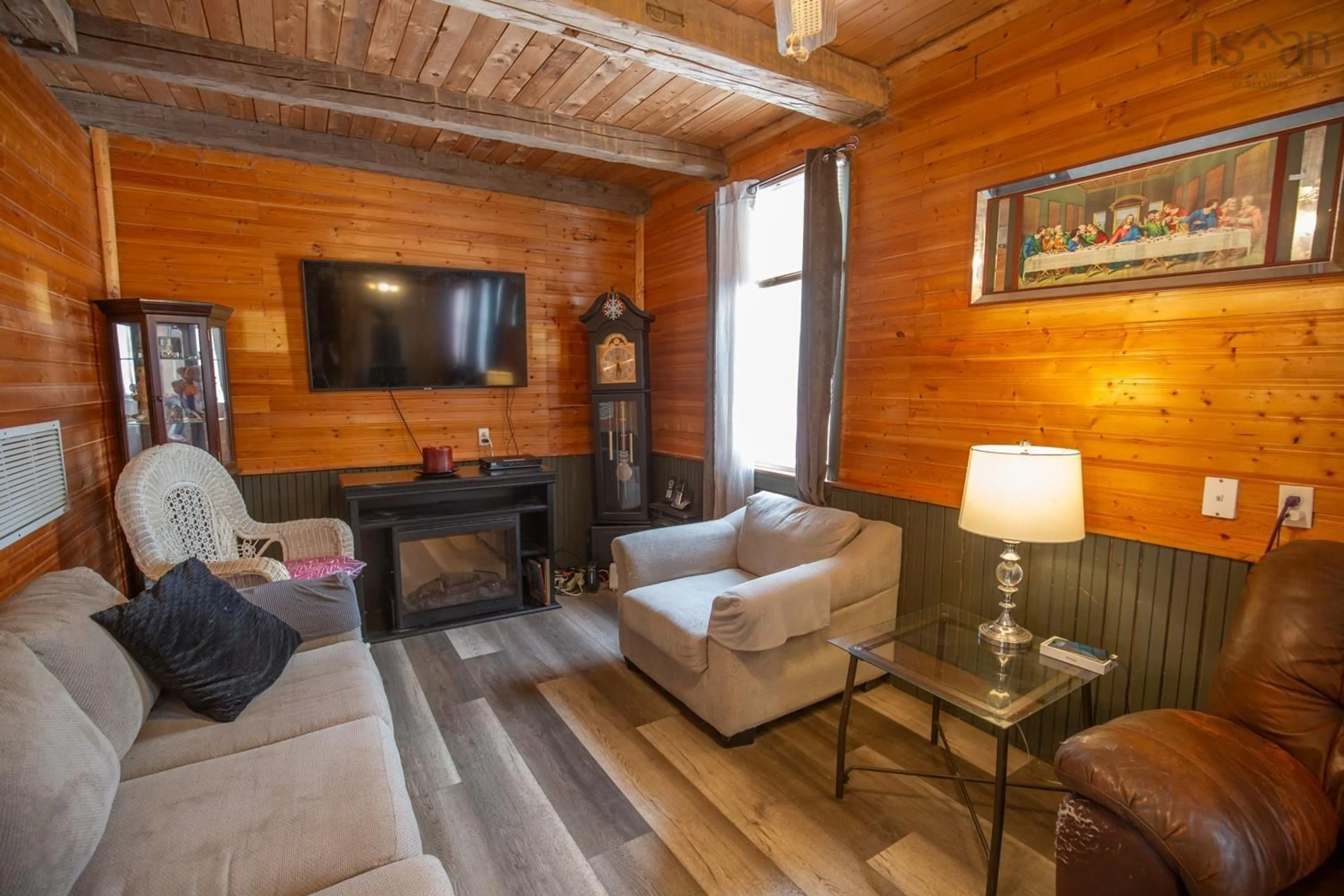 Living room with furniture, wood/laminate floor for 107 Upper Pembroke Rd, Pembroke Nova Scotia B0N 2P0