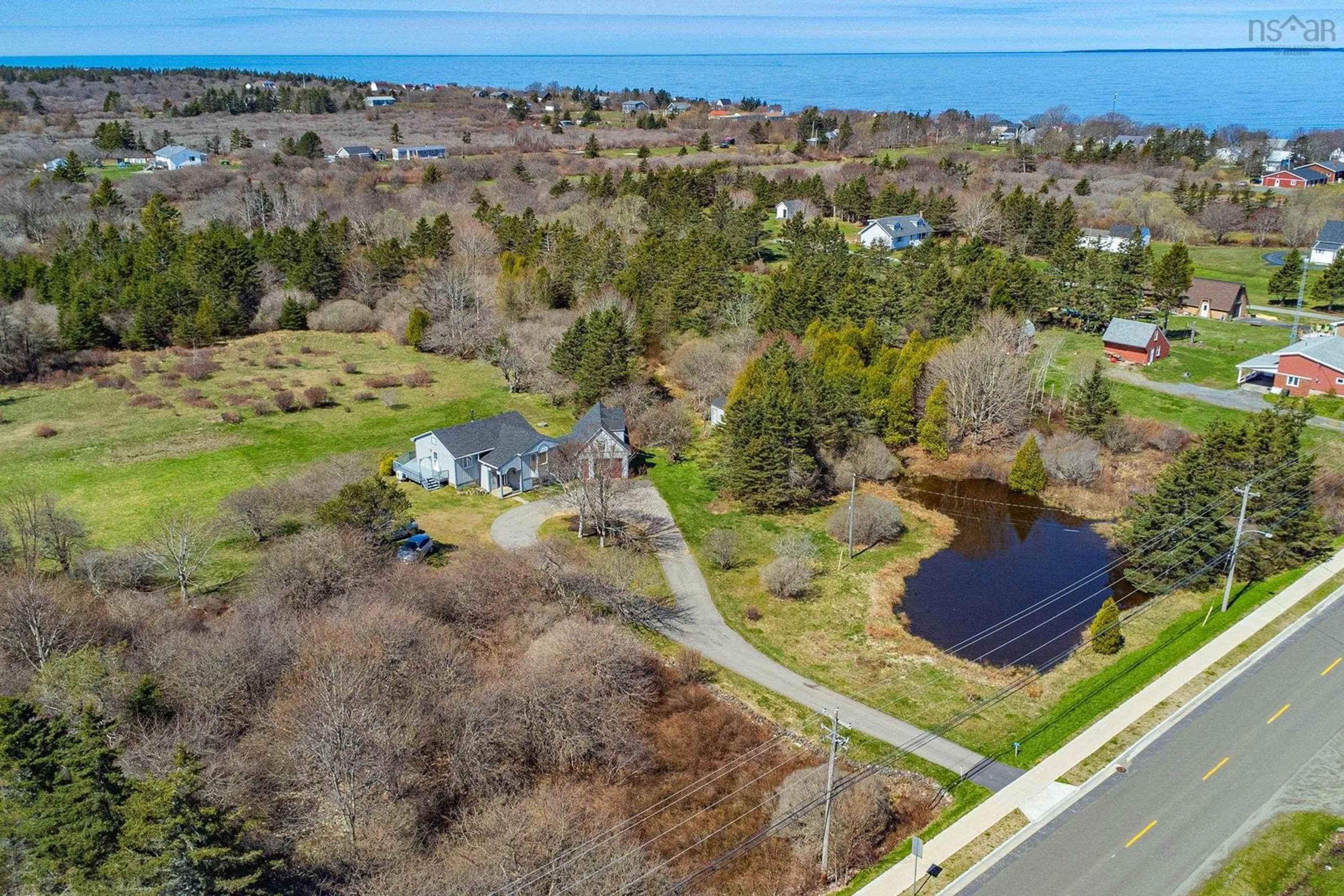 A pic from outside/outdoor area/front of a property/back of a property/a pic from drone, water/lake/river/ocean view for 226 Peter Dugas Road, Meteghan Nova Scotia B0W 2J0