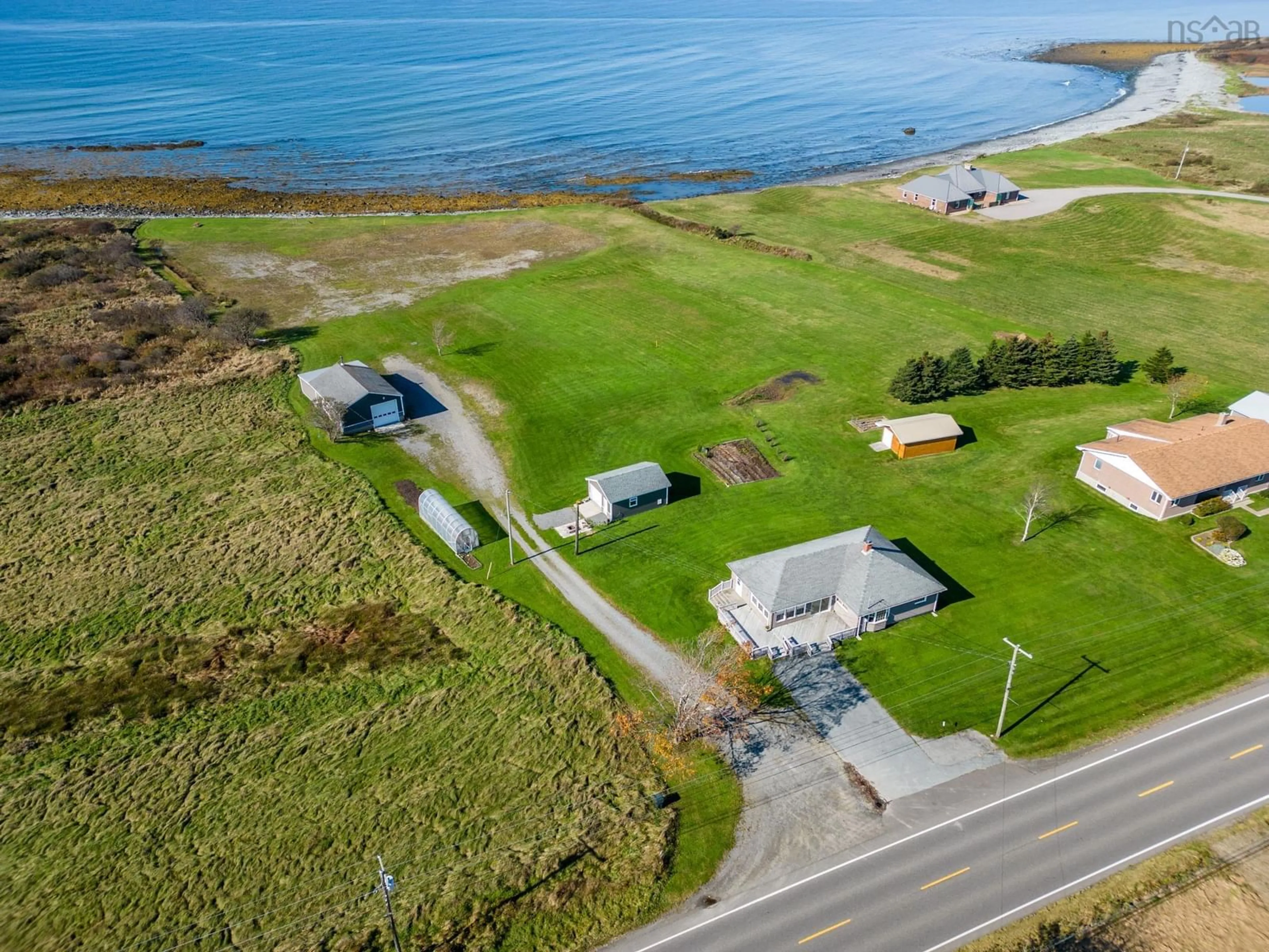 A pic from outside/outdoor area/front of a property/back of a property/a pic from drone, water/lake/river/ocean view for 1271 Highway 1, Little Brook Nova Scotia B0W 1M0