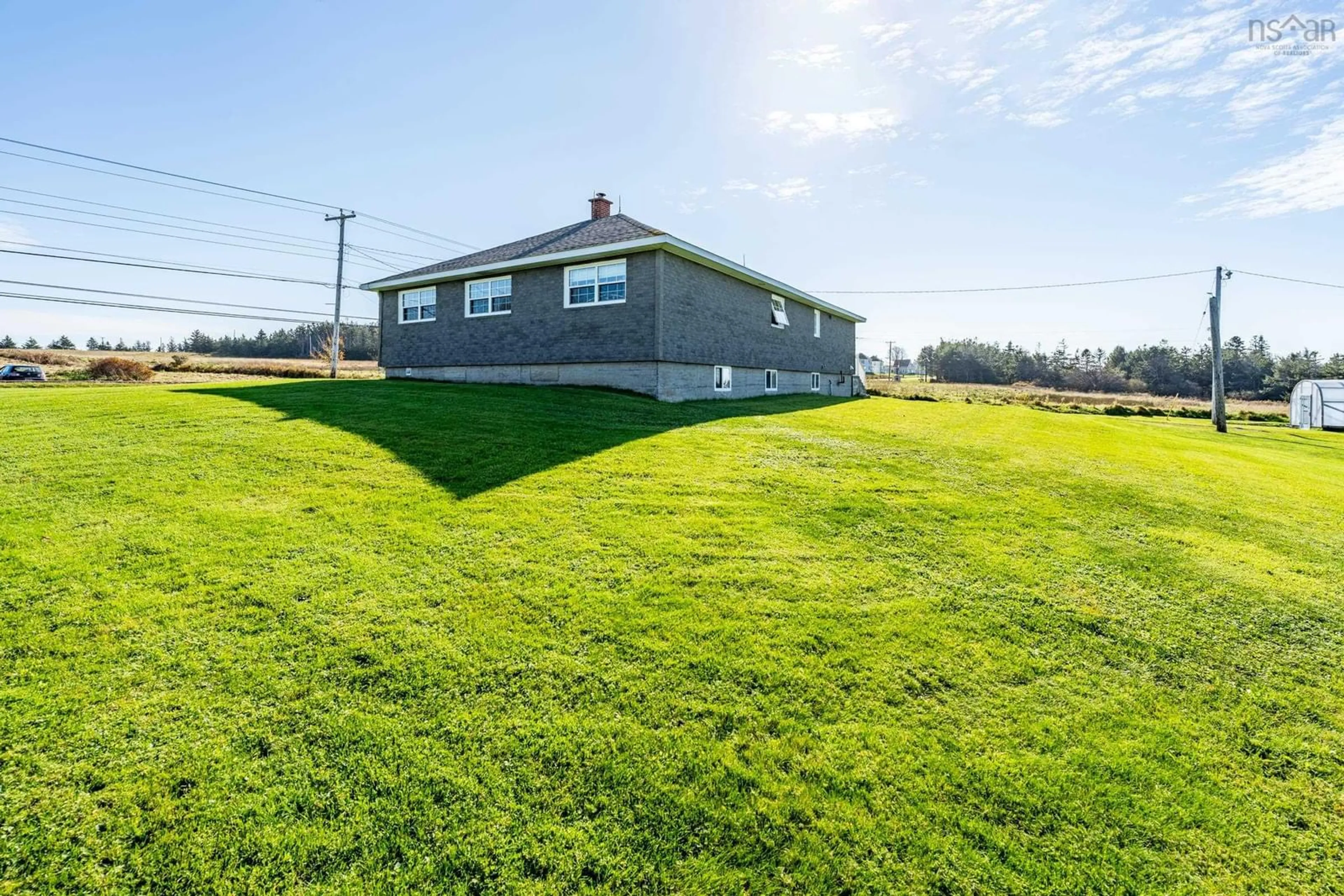 A pic from outside/outdoor area/front of a property/back of a property/a pic from drone, water/lake/river/ocean view for 1271 Highway 1, Little Brook Nova Scotia B0W 1M0