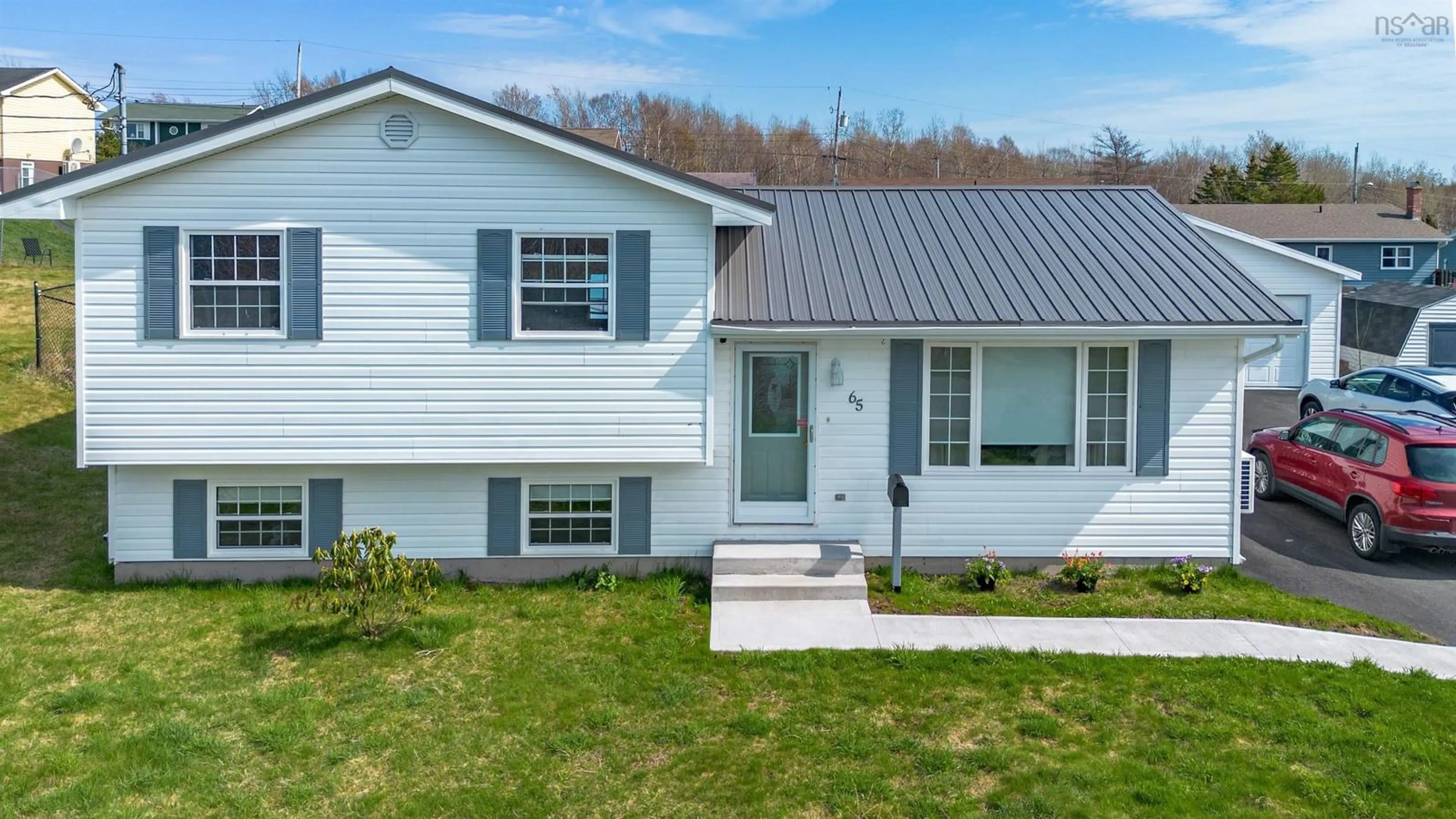 Home with vinyl exterior material, street for 65 Macdonald Cres, Sydney Mines Nova Scotia B1V 3L9