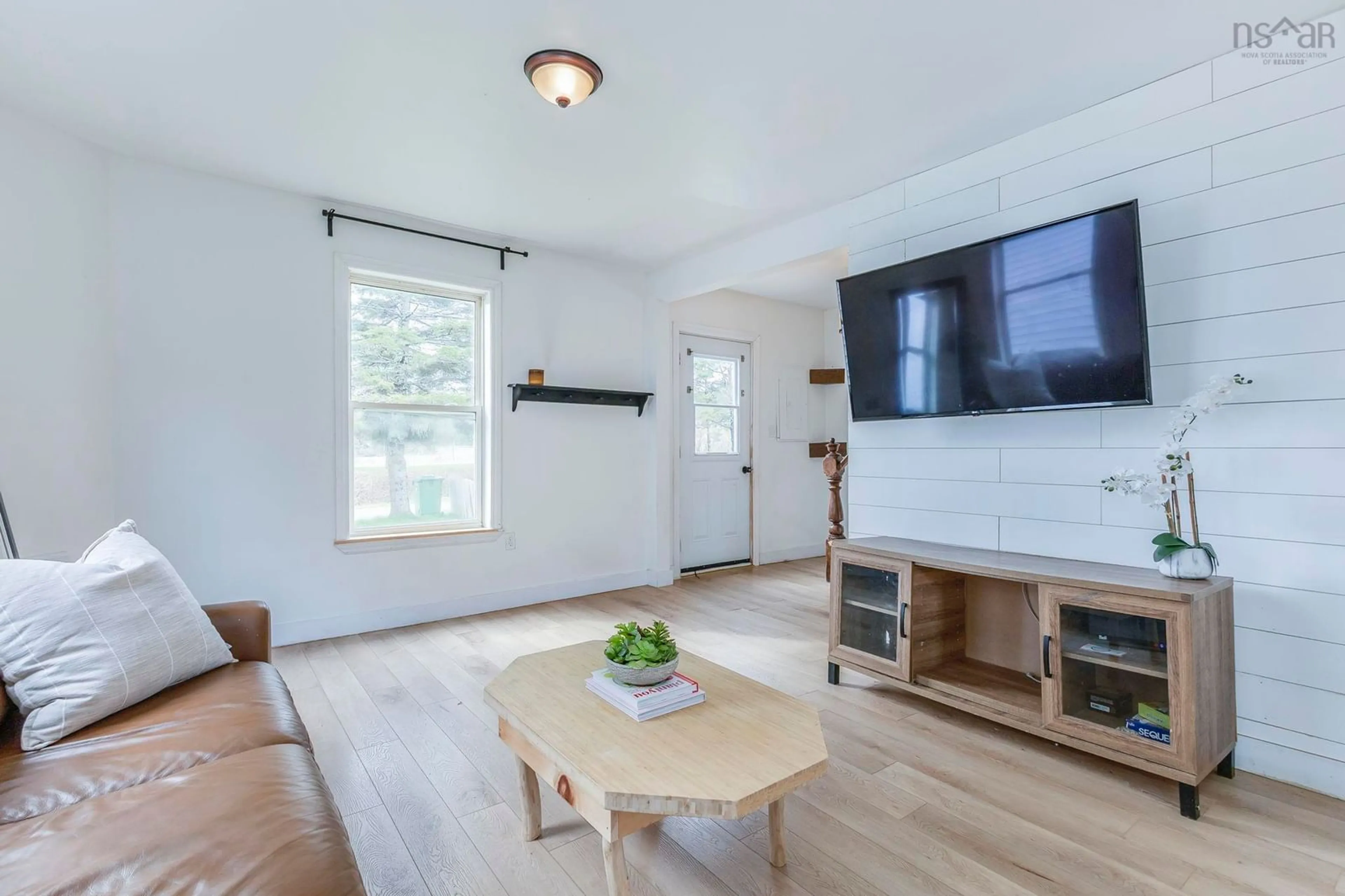 Living room with furniture, wood/laminate floor for 19 Station Rd, South Maitland Nova Scotia B0N 2H0