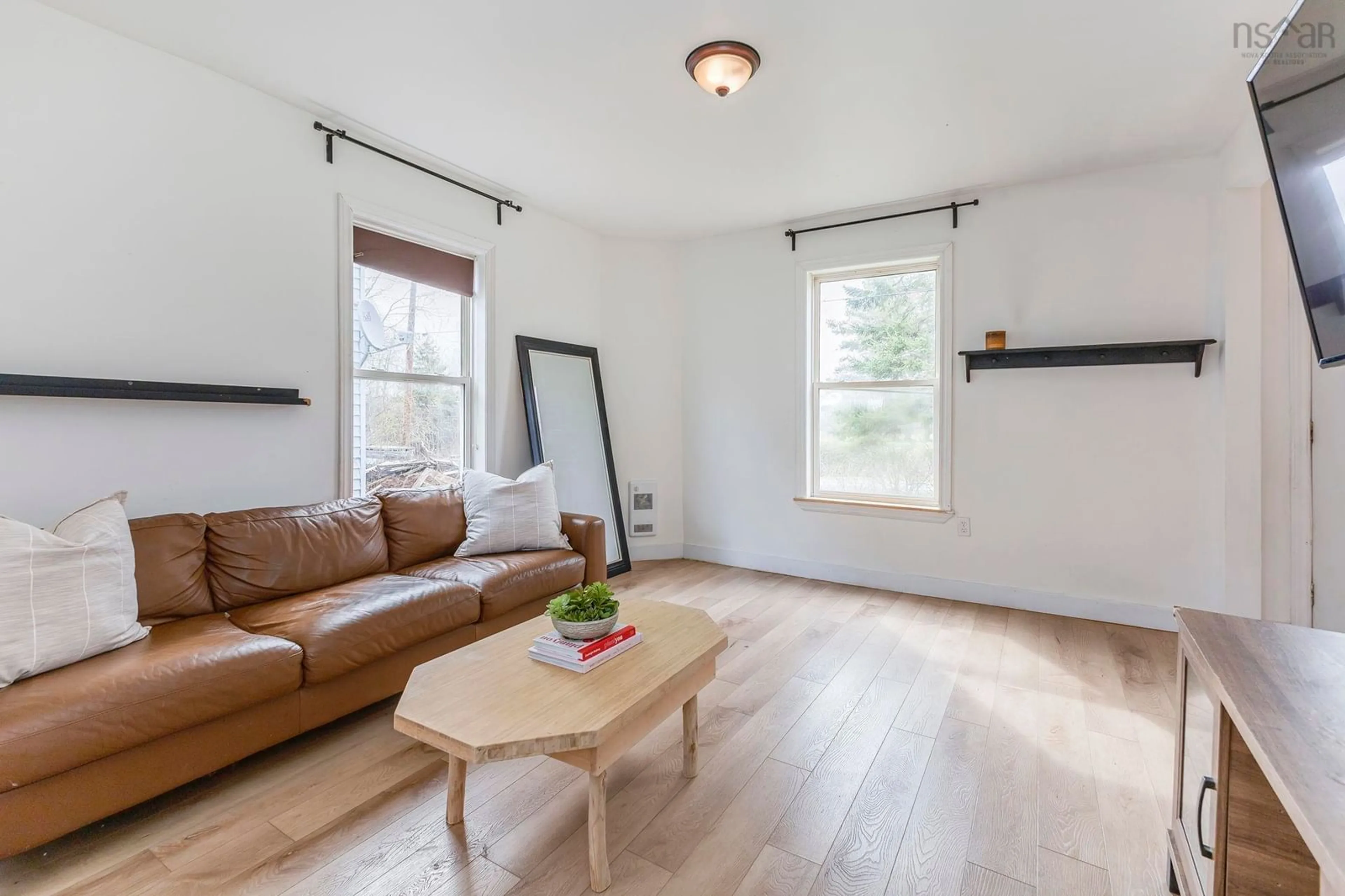 Living room with furniture, wood/laminate floor for 19 Station Rd, South Maitland Nova Scotia B0N 2H0