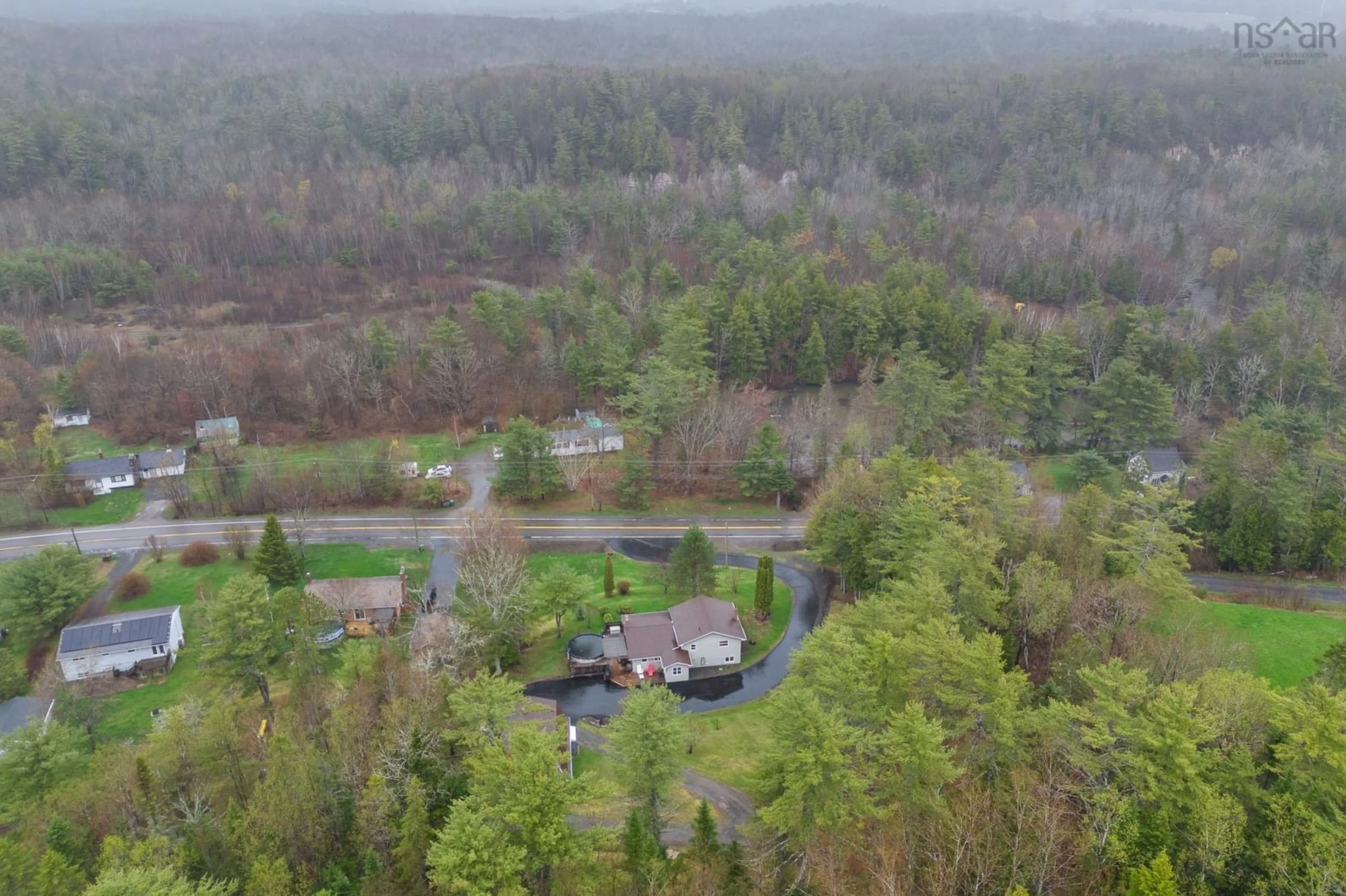 A pic from outside/outdoor area/front of a property/back of a property/a pic from drone, forest/trees view for 6054 Highway 1, Ellershouse Nova Scotia B0N 1L0