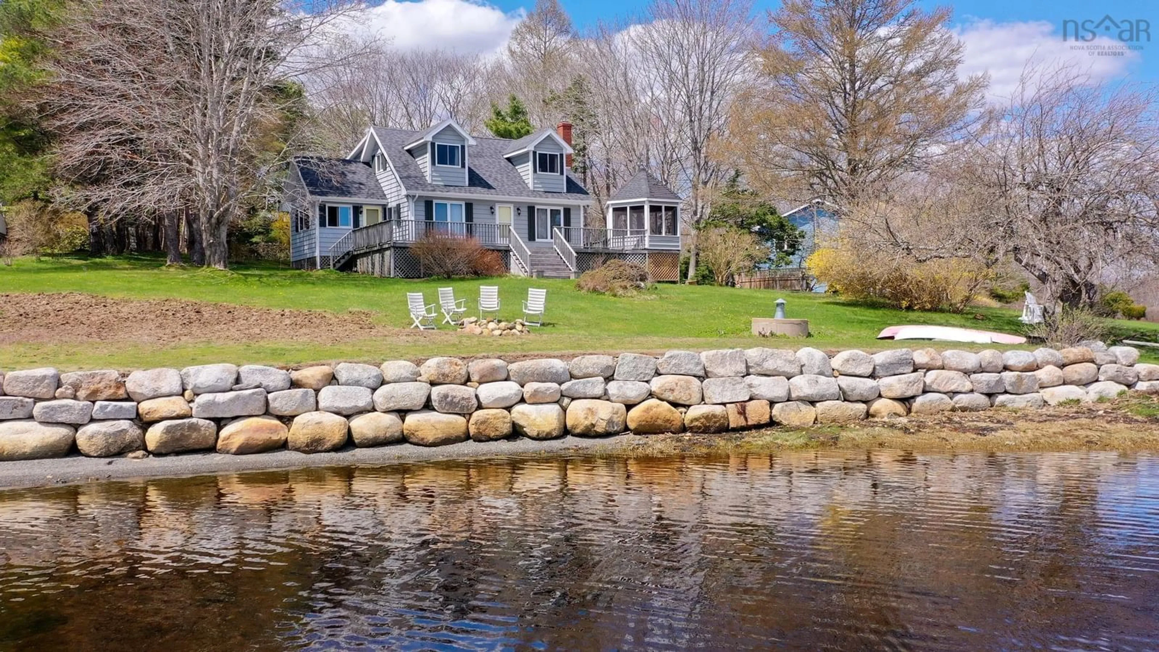 A pic from outside/outdoor area/front of a property/back of a property/a pic from drone, water/lake/river/ocean view for 45 Little Vaughan Lake Road, Western Shore Nova Scotia B0J 3M0