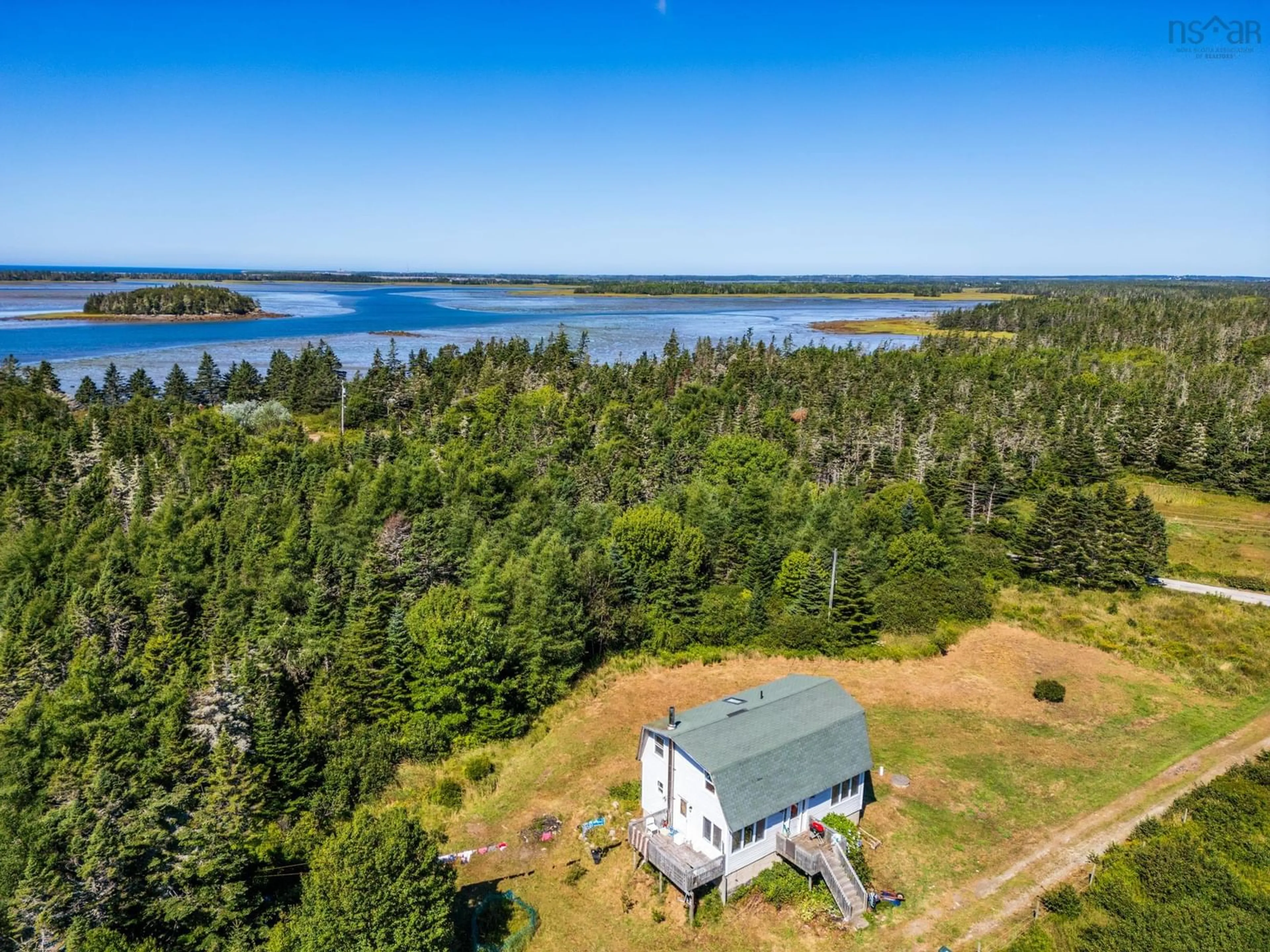 A pic from outside/outdoor area/front of a property/back of a property/a pic from drone, water/lake/river/ocean view for 47 Golden Glow Lane, Little River Harbour Nova Scotia B0W 1B0