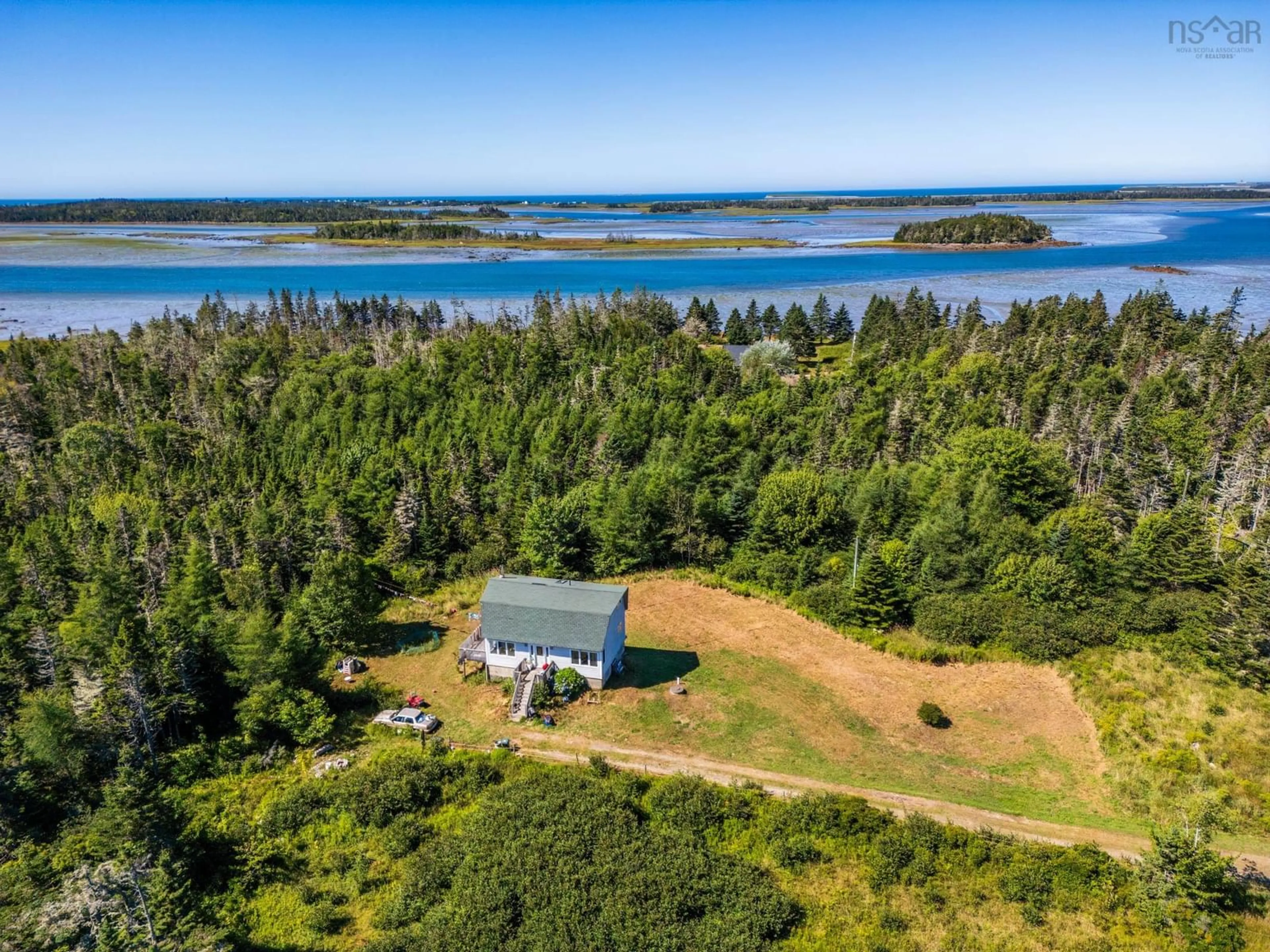 A pic from outside/outdoor area/front of a property/back of a property/a pic from drone, water/lake/river/ocean view for 47 Golden Glow Lane, Little River Harbour Nova Scotia B0W 1B0