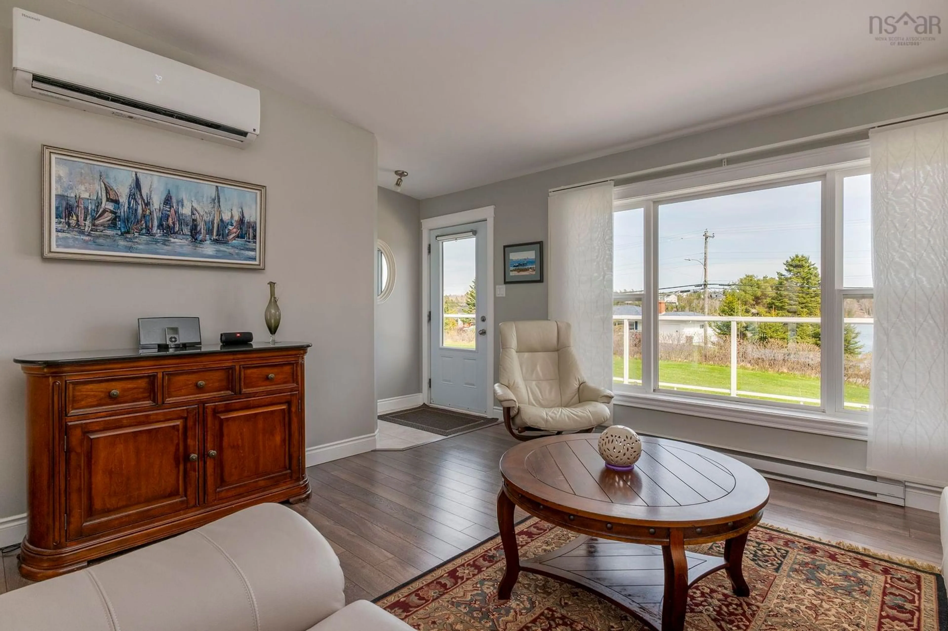 Living room with furniture, wood/laminate floor for 27 Prospect Bay Rd, Prospect Bay Nova Scotia B3T 1Z4