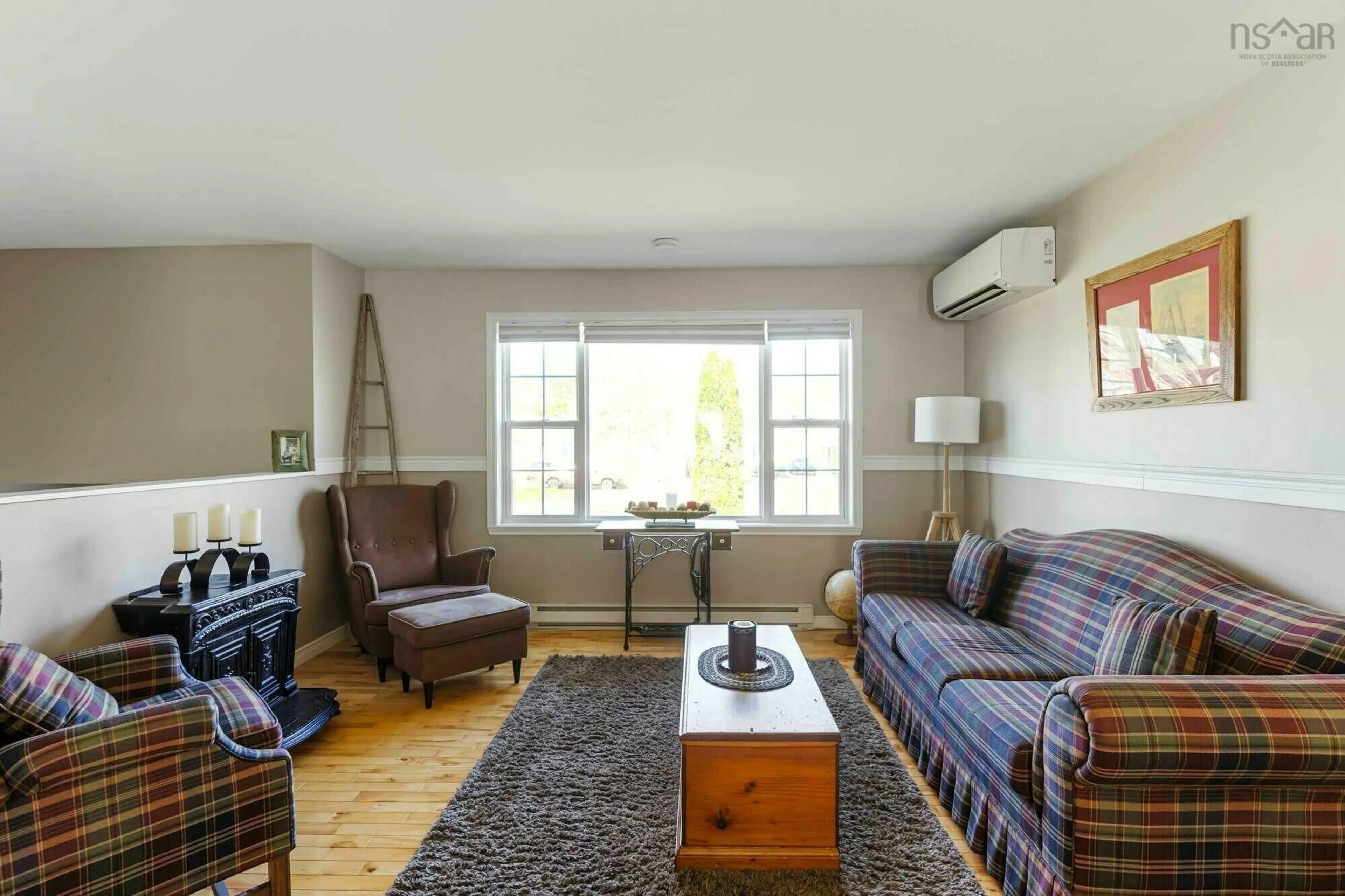 Living room with furniture, wood/laminate floor for 8 Robie Ave, Greenwood Nova Scotia B0P 1R0