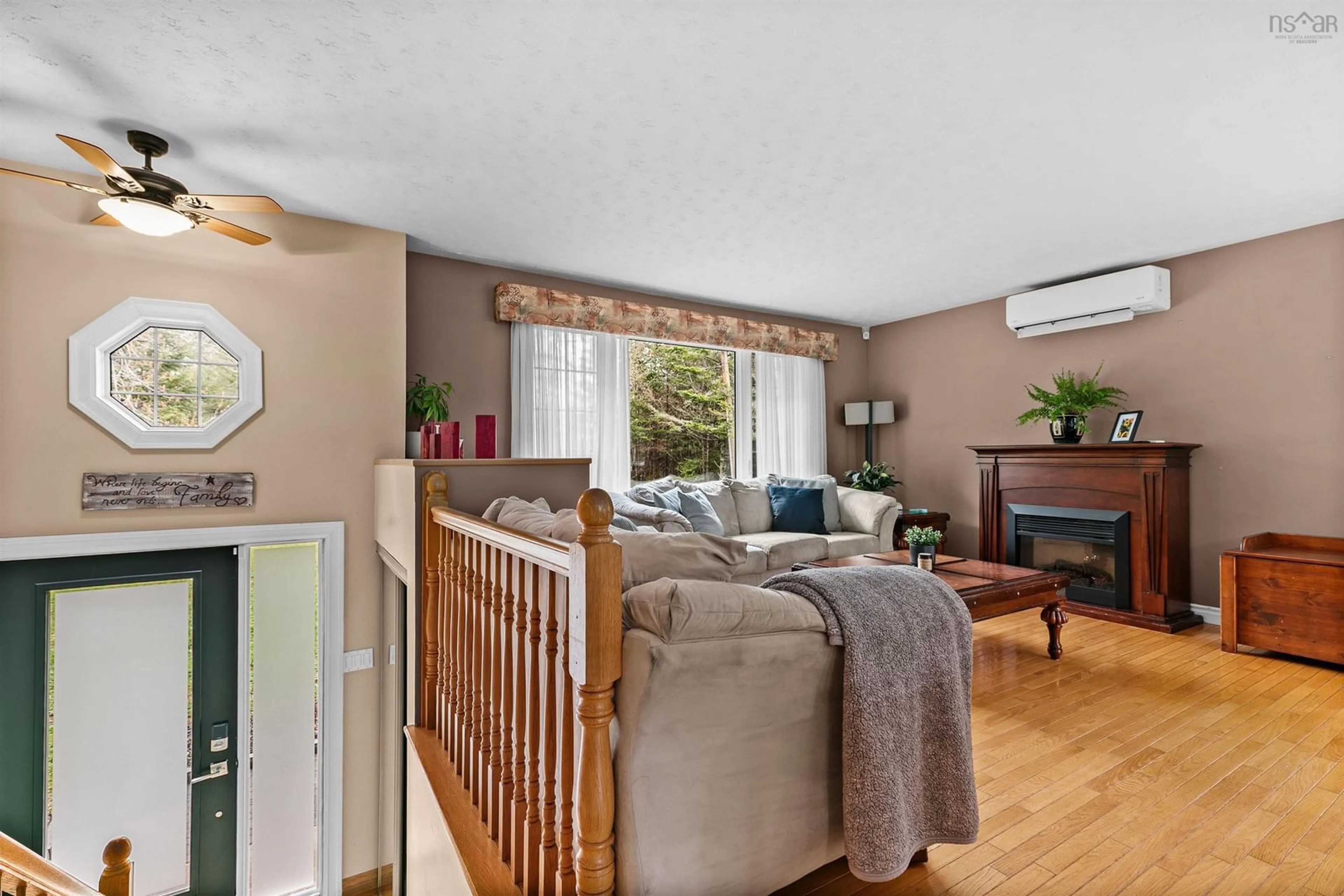 Living room with furniture, wood/laminate floor for 563 Mineville Rd, Mineville Nova Scotia B2Z 1J9