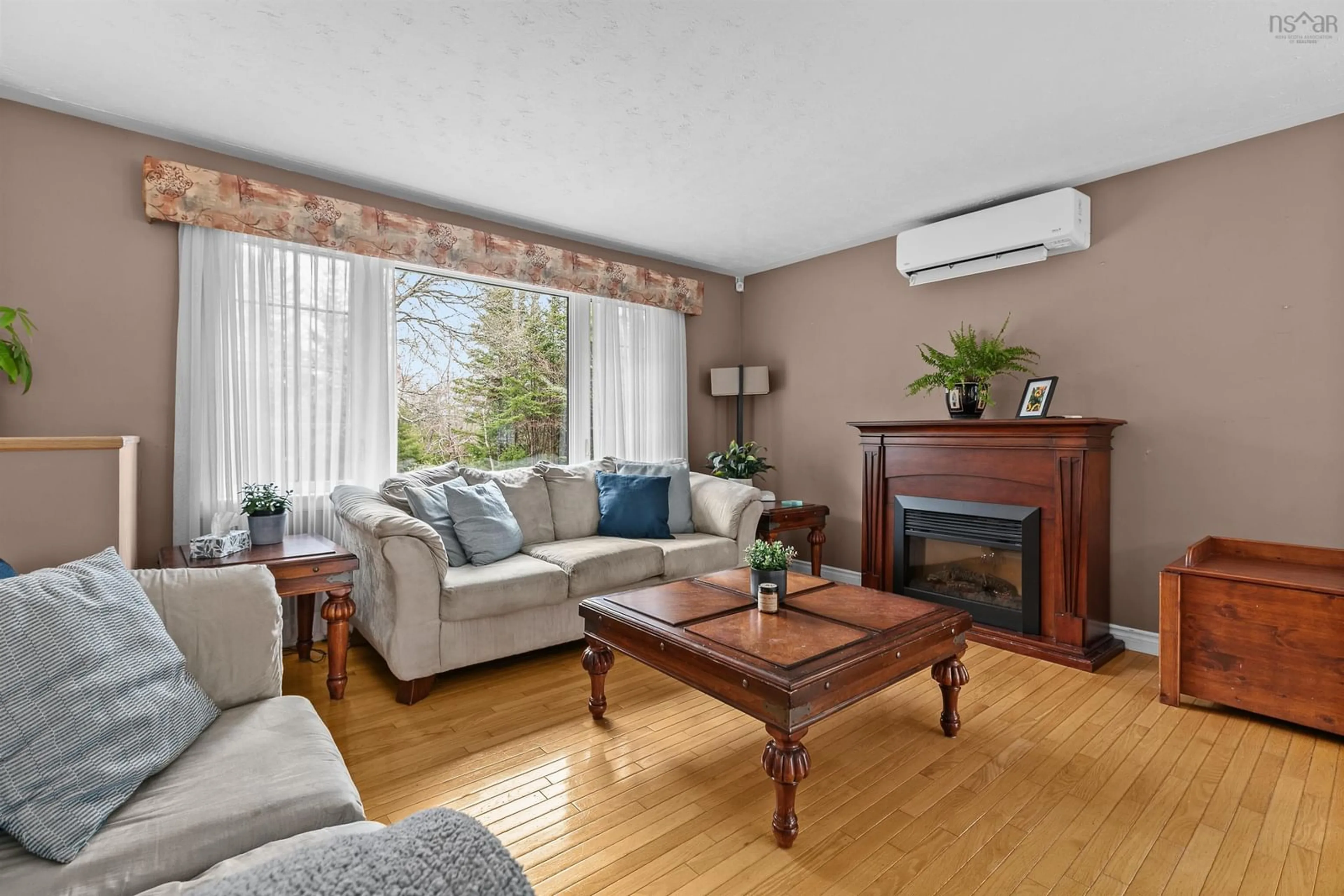 Living room with furniture, wood/laminate floor for 563 Mineville Rd, Mineville Nova Scotia B2Z 1J9