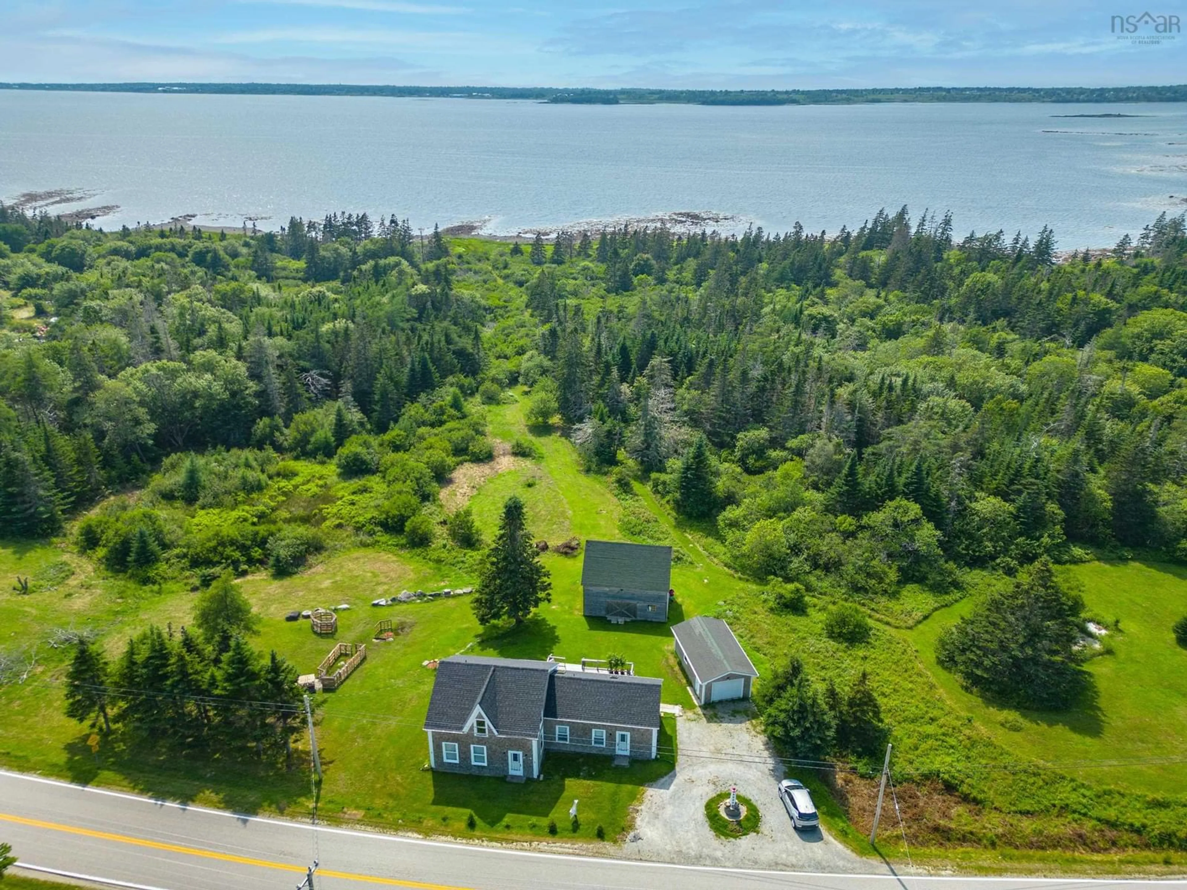 A pic from outside/outdoor area/front of a property/back of a property/a pic from drone, water/lake/river/ocean view for 1663 Highway 3, East Pubnico Nova Scotia B0W 2A0