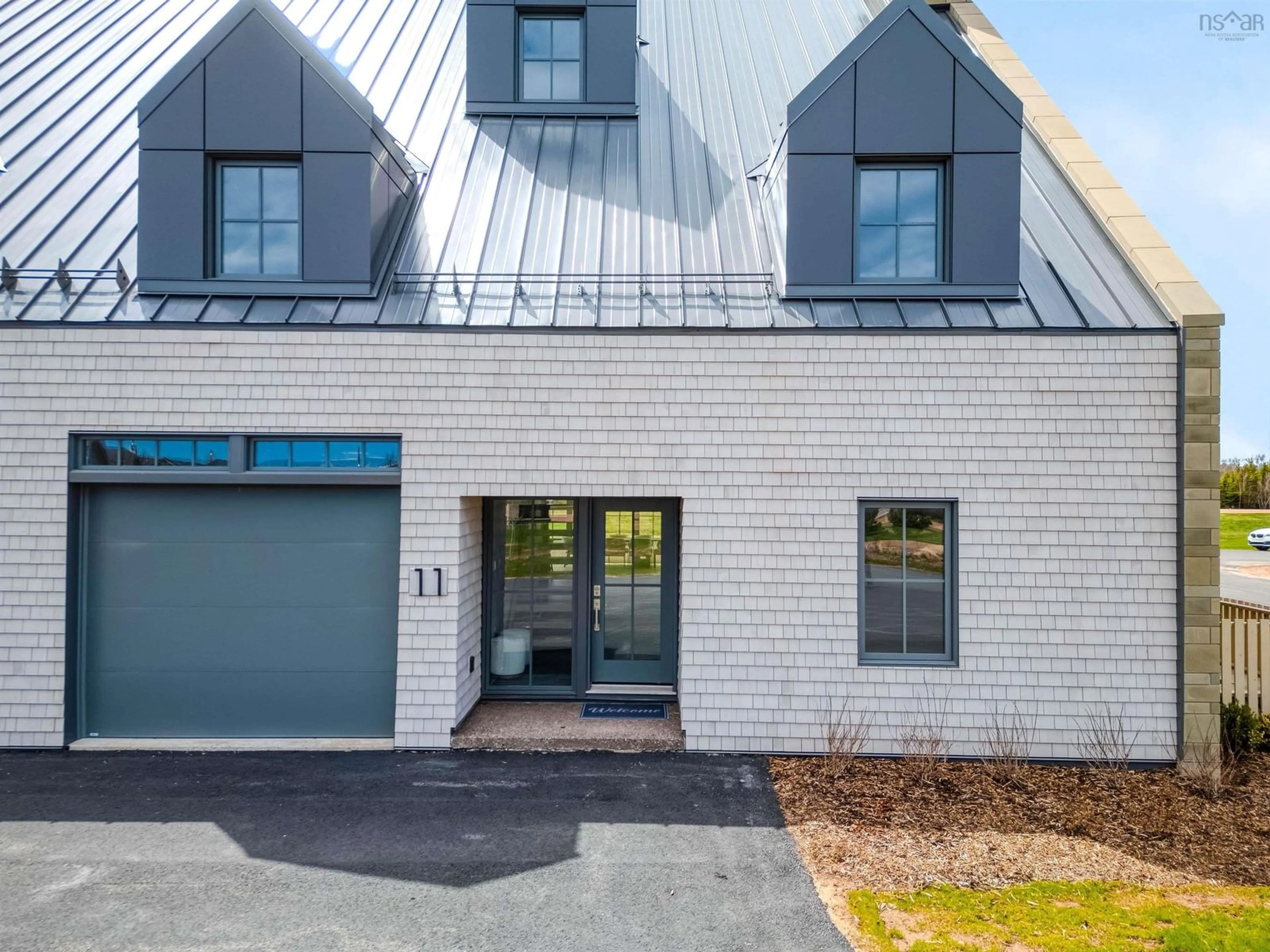 Home with brick exterior material, street for 11 Spinnaker Run, Fox Harbour Nova Scotia B0K 1Y0