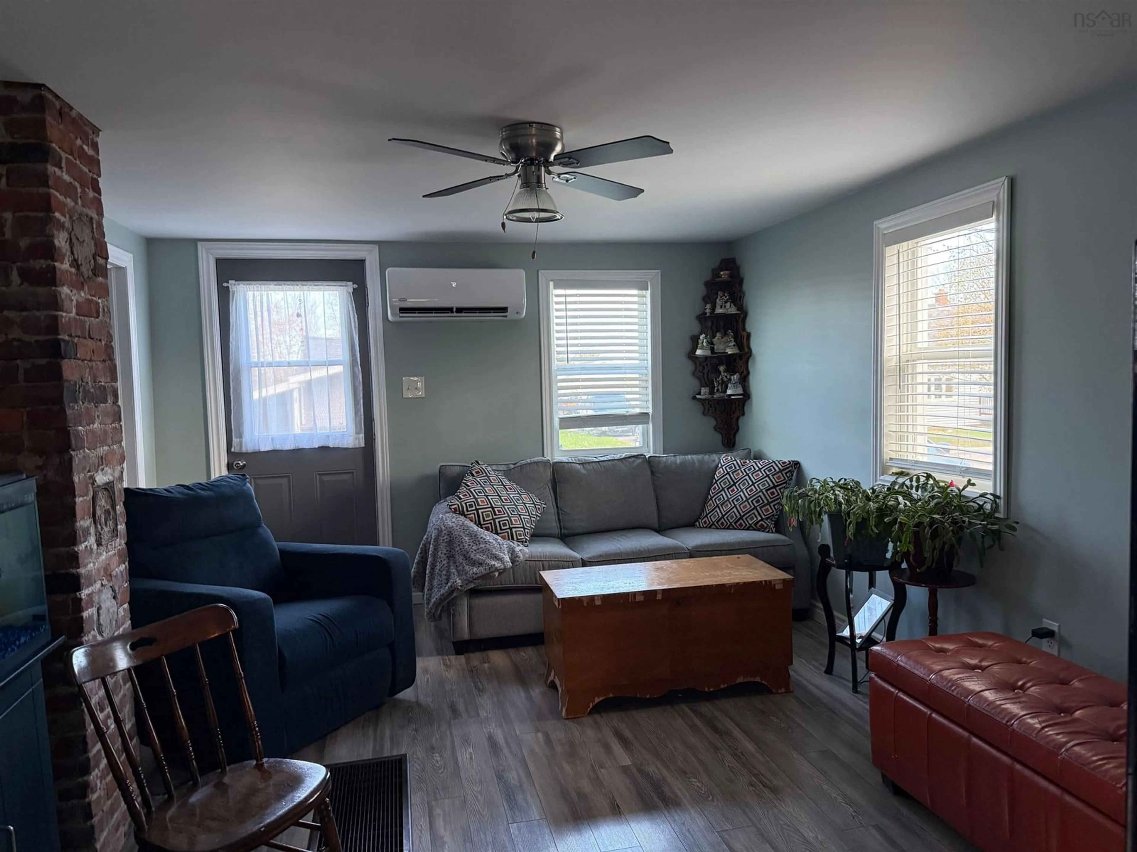 Living room with furniture, wood/laminate floor for 39 Coll Ave, Stellarton Nova Scotia B0K 1S0