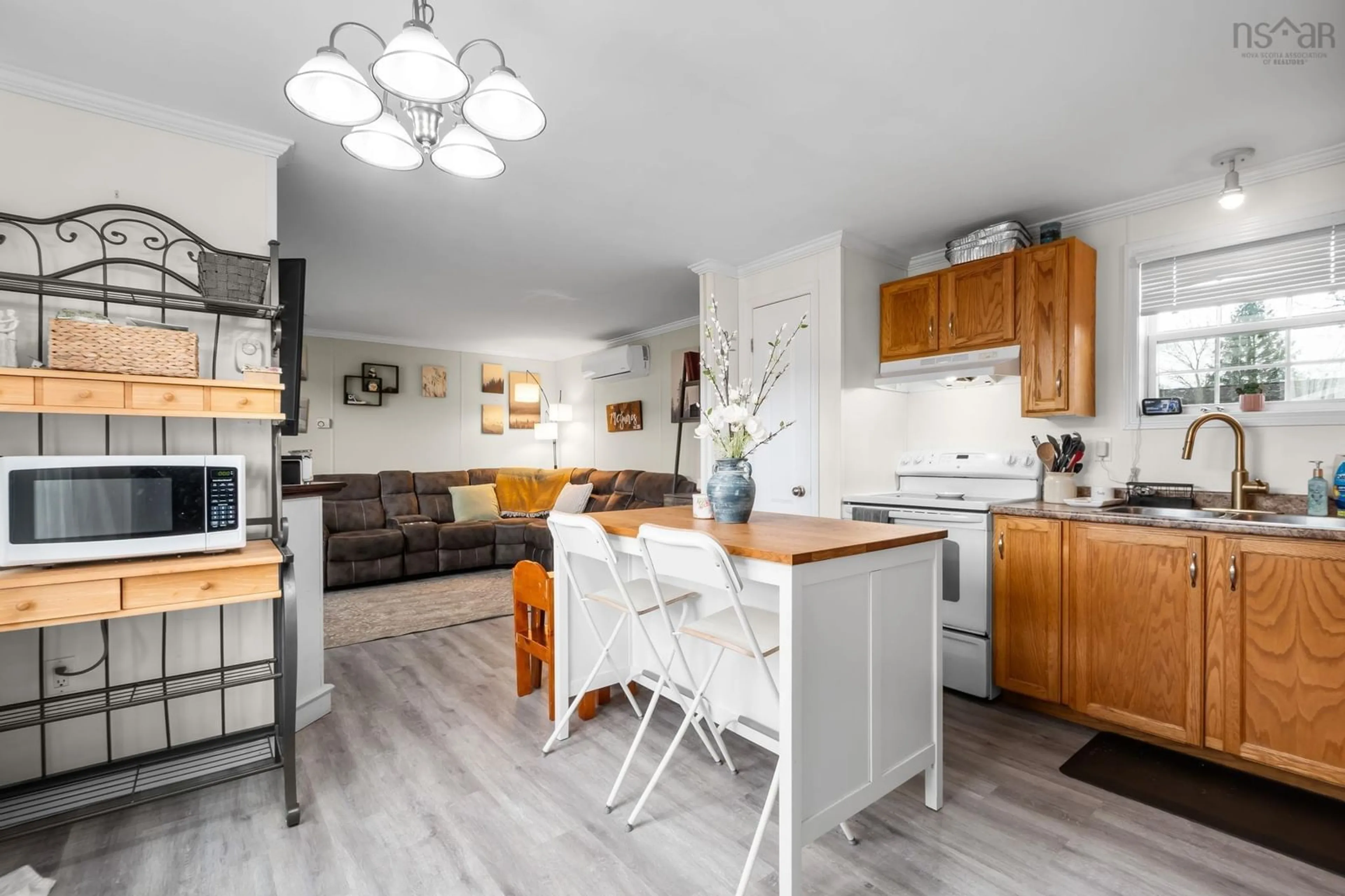 Open concept kitchen, wood/laminate floor for 6 Sue Ann Ave, Mount Uniacke Nova Scotia B0N 1Z0
