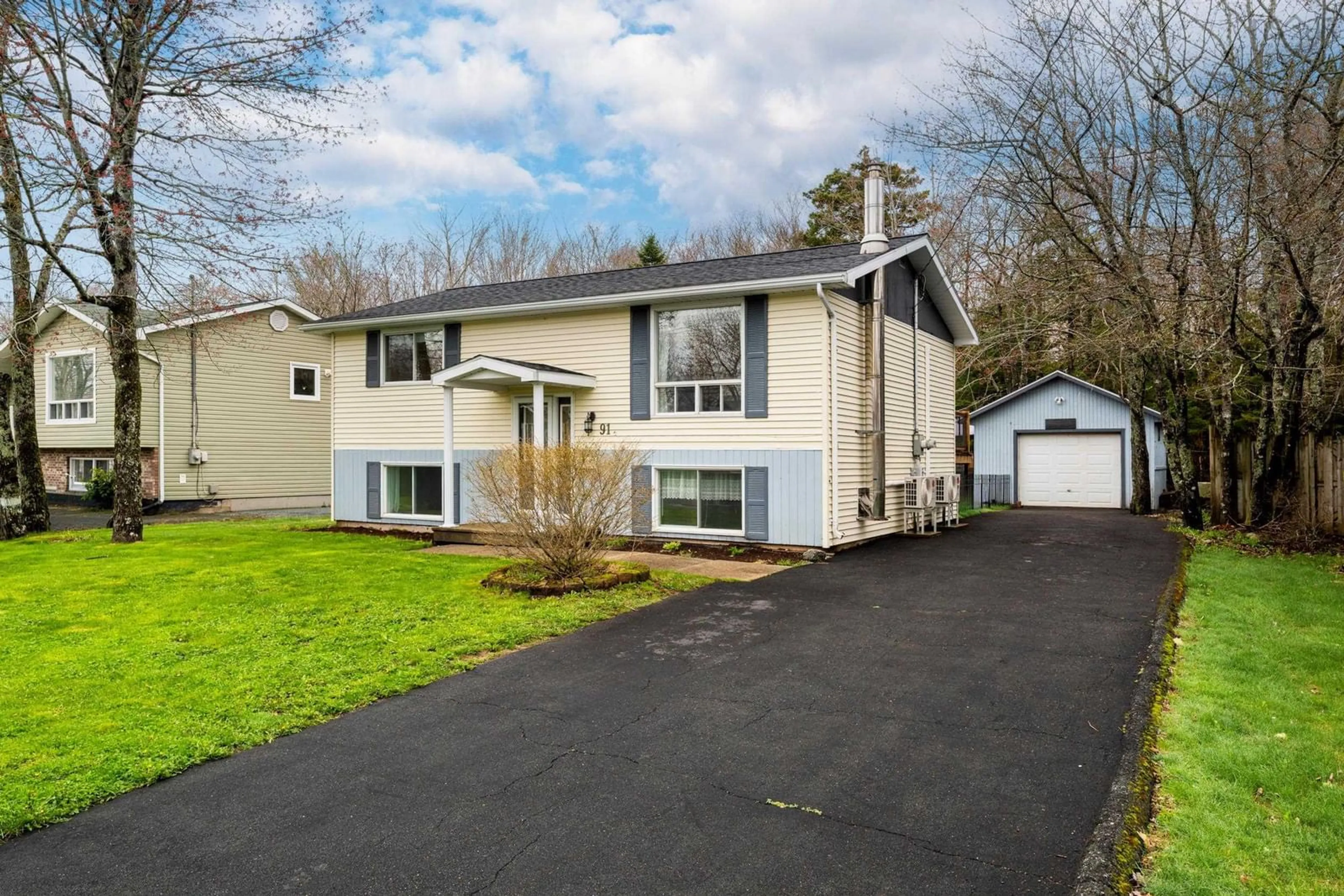 Home with vinyl exterior material, street for 91 Cavalier Dr, Lower Sackville Nova Scotia B4C 3K6