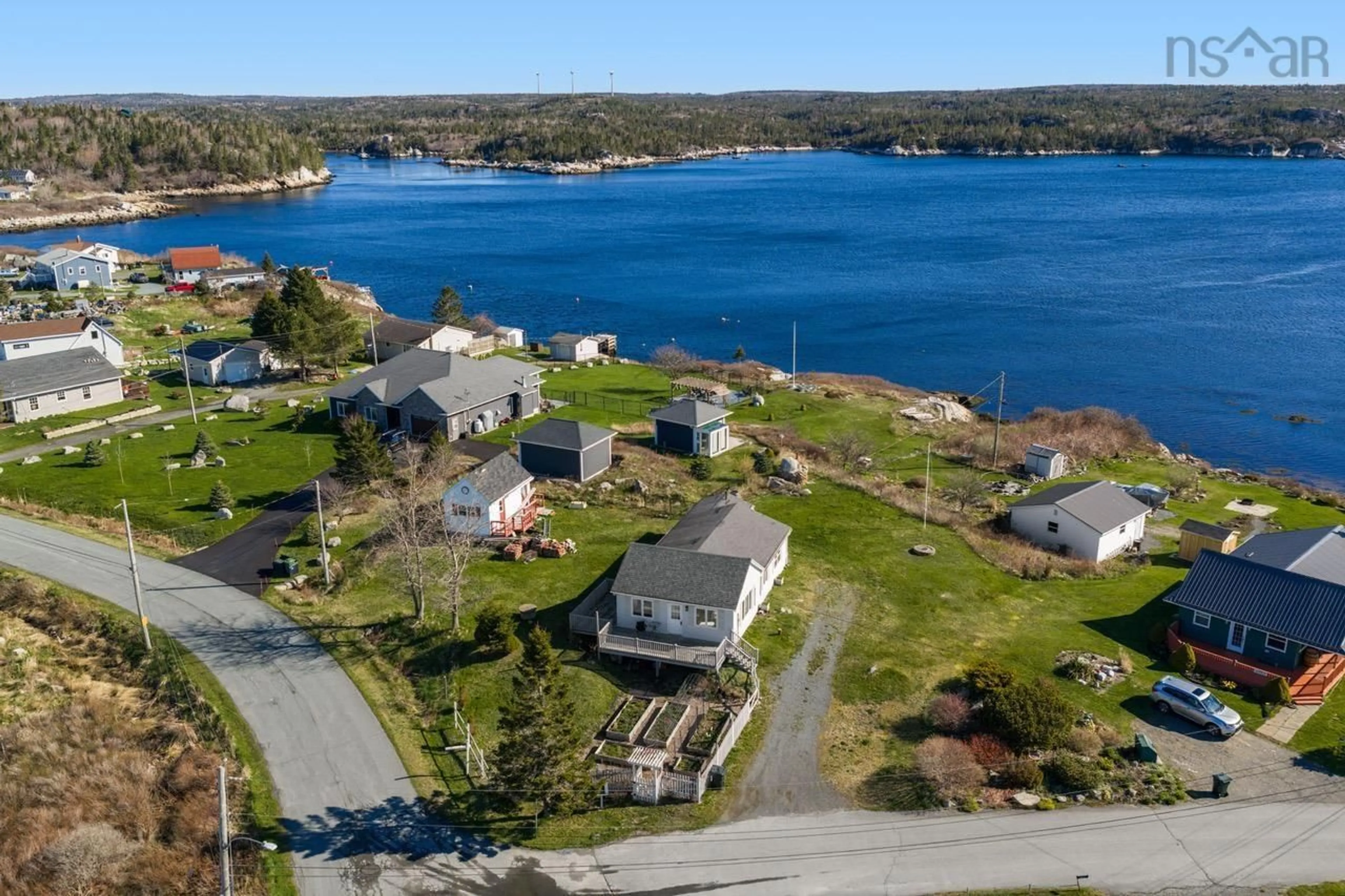 A pic from outside/outdoor area/front of a property/back of a property/a pic from drone, water/lake/river/ocean view for 10 Terence Bay Wharf Rd, Terence Bay Nova Scotia B3T 1Y3