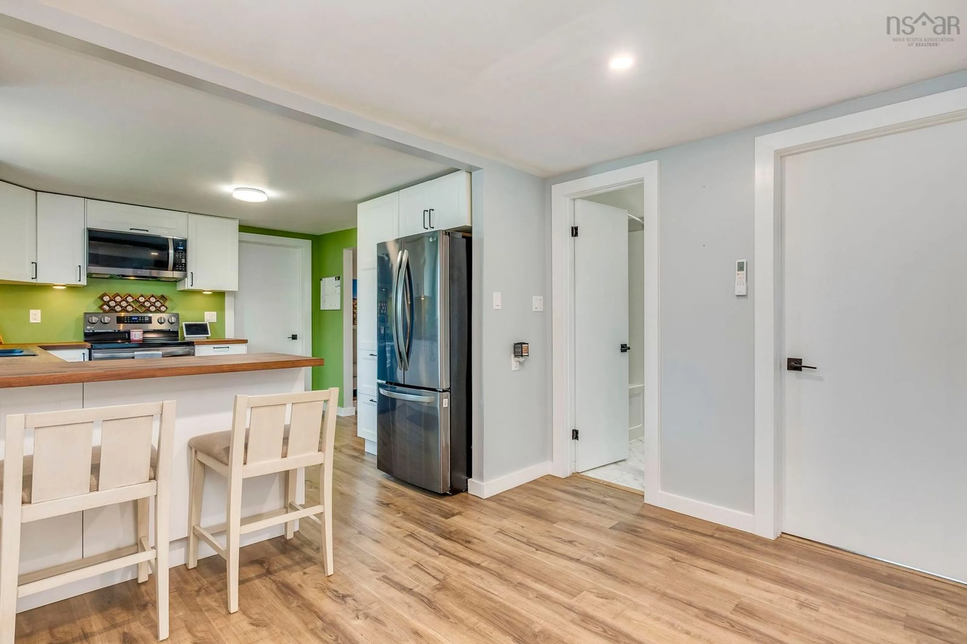 Open concept kitchen, wood/laminate floor for 9308 1 Hwy, Bridgetown East Nova Scotia B0S 1C0