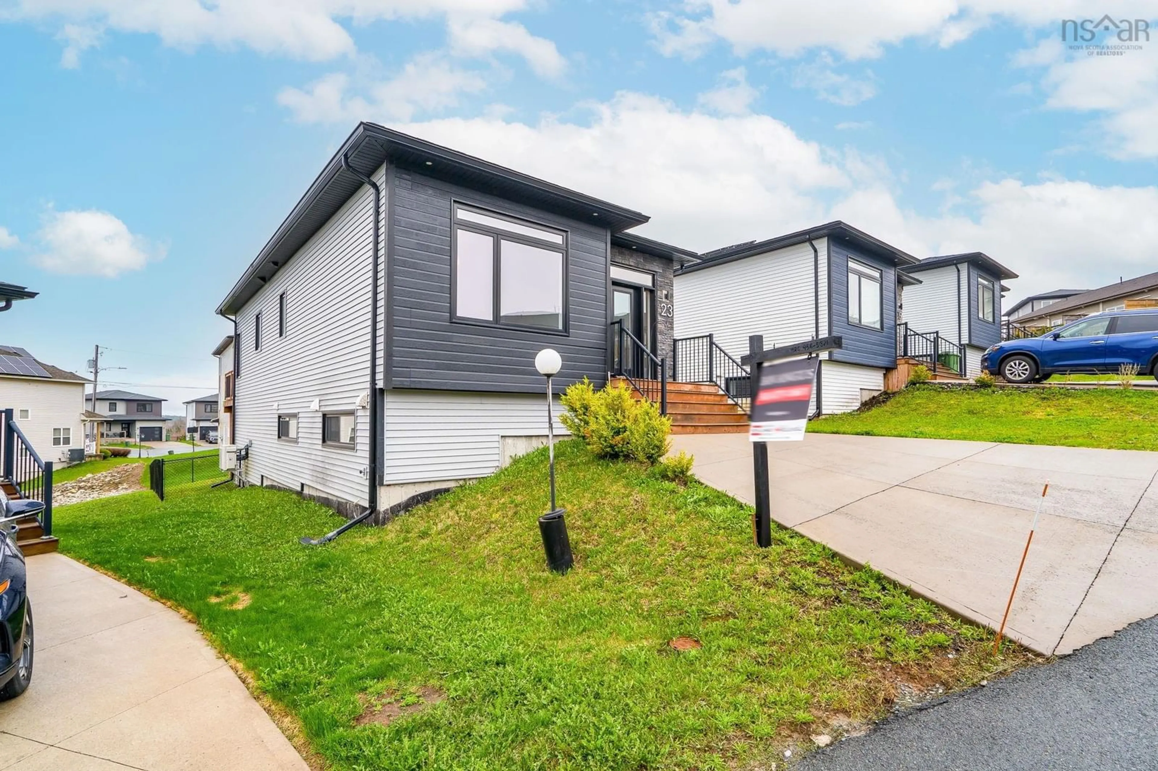 Home with vinyl exterior material, street for 23 Thorngrove Lane, Timberlea Nova Scotia B3T 0K1