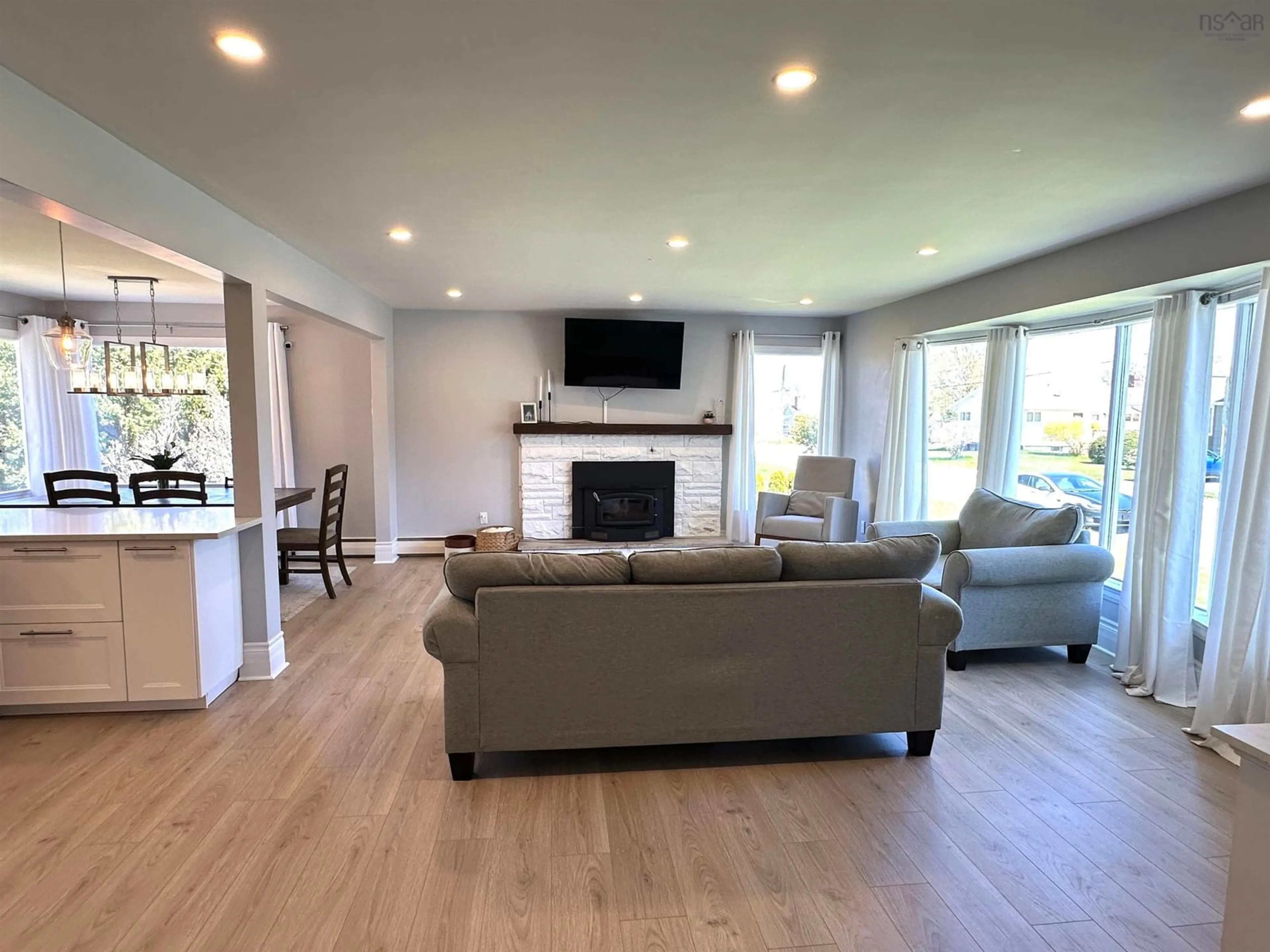 Living room with furniture, wood/laminate floor for 42 William St, Liverpool Nova Scotia B0T 1K0