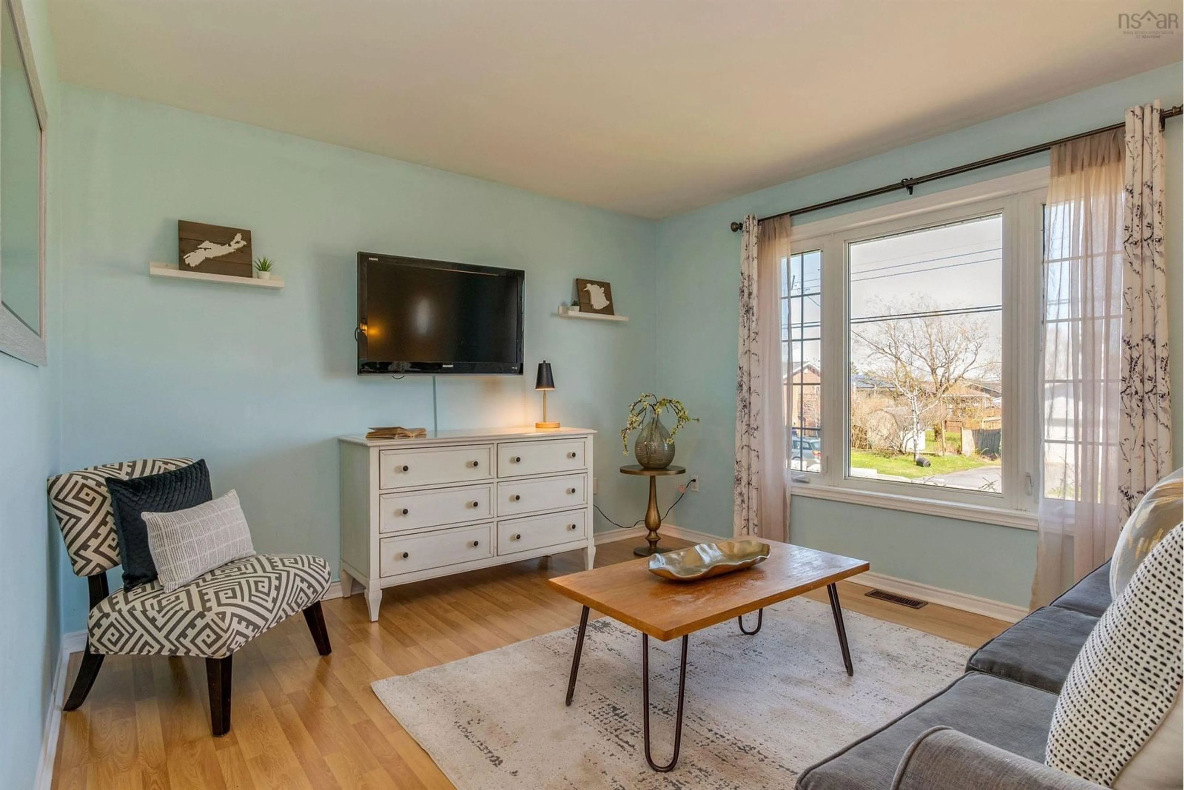 Living room with furniture, wood/laminate floor for 107 Shrewsbury Rd, Cole Harbour Nova Scotia B2V 2C4